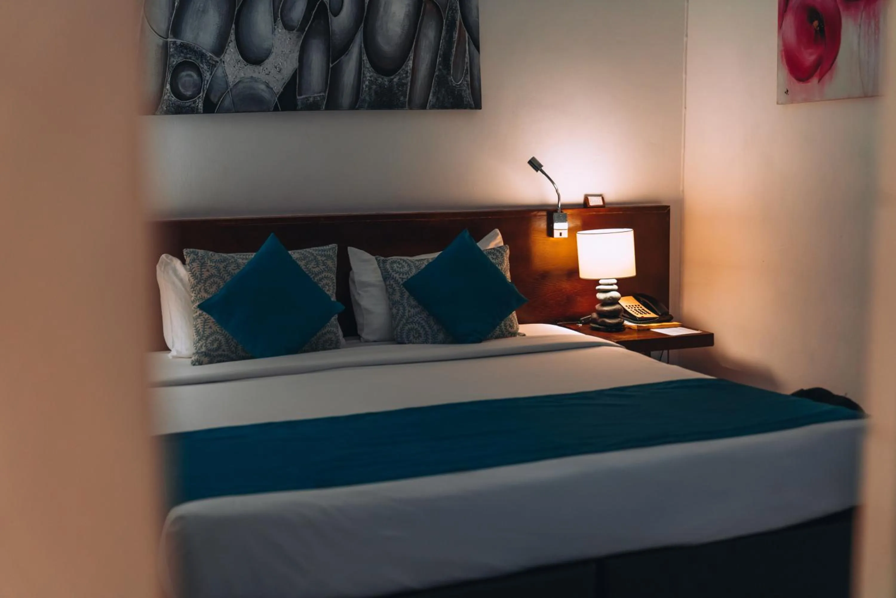 Bed in Casuarina Resort and Spa