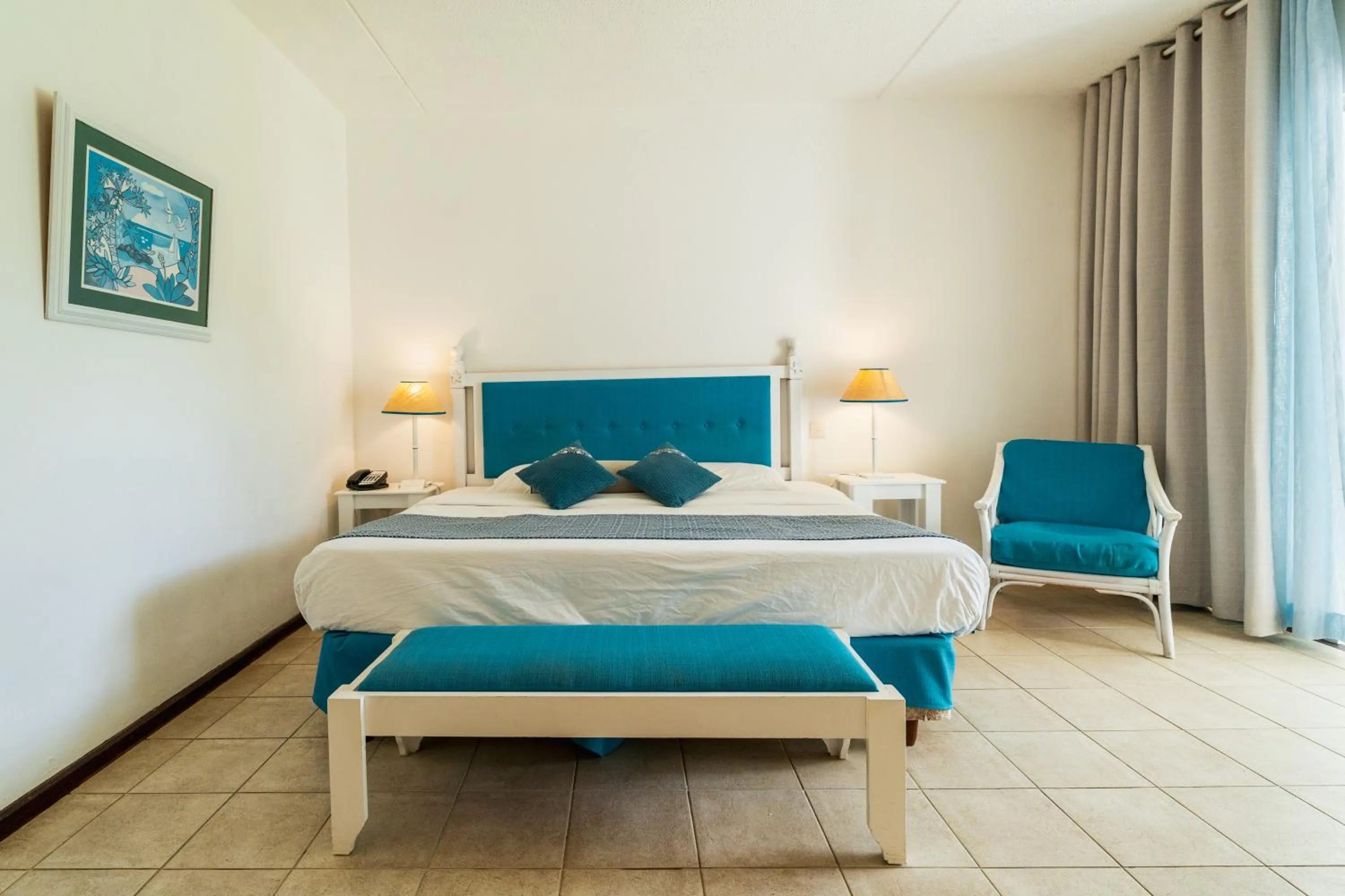 Bed in Casuarina Resort and Spa