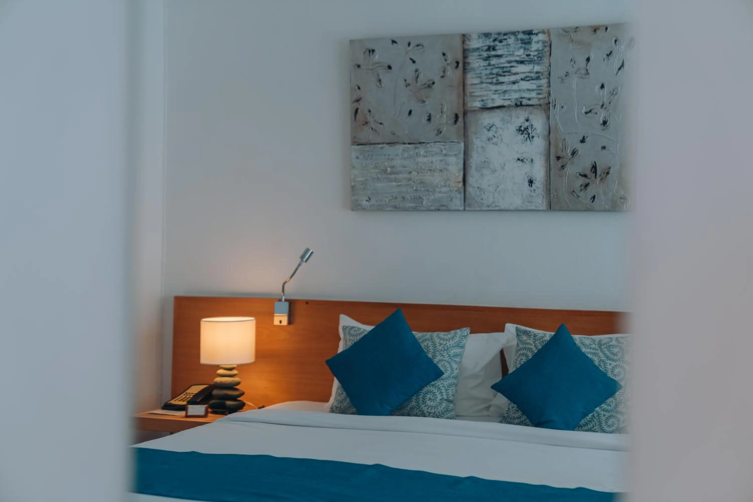 Bed in Casuarina Resort and Spa