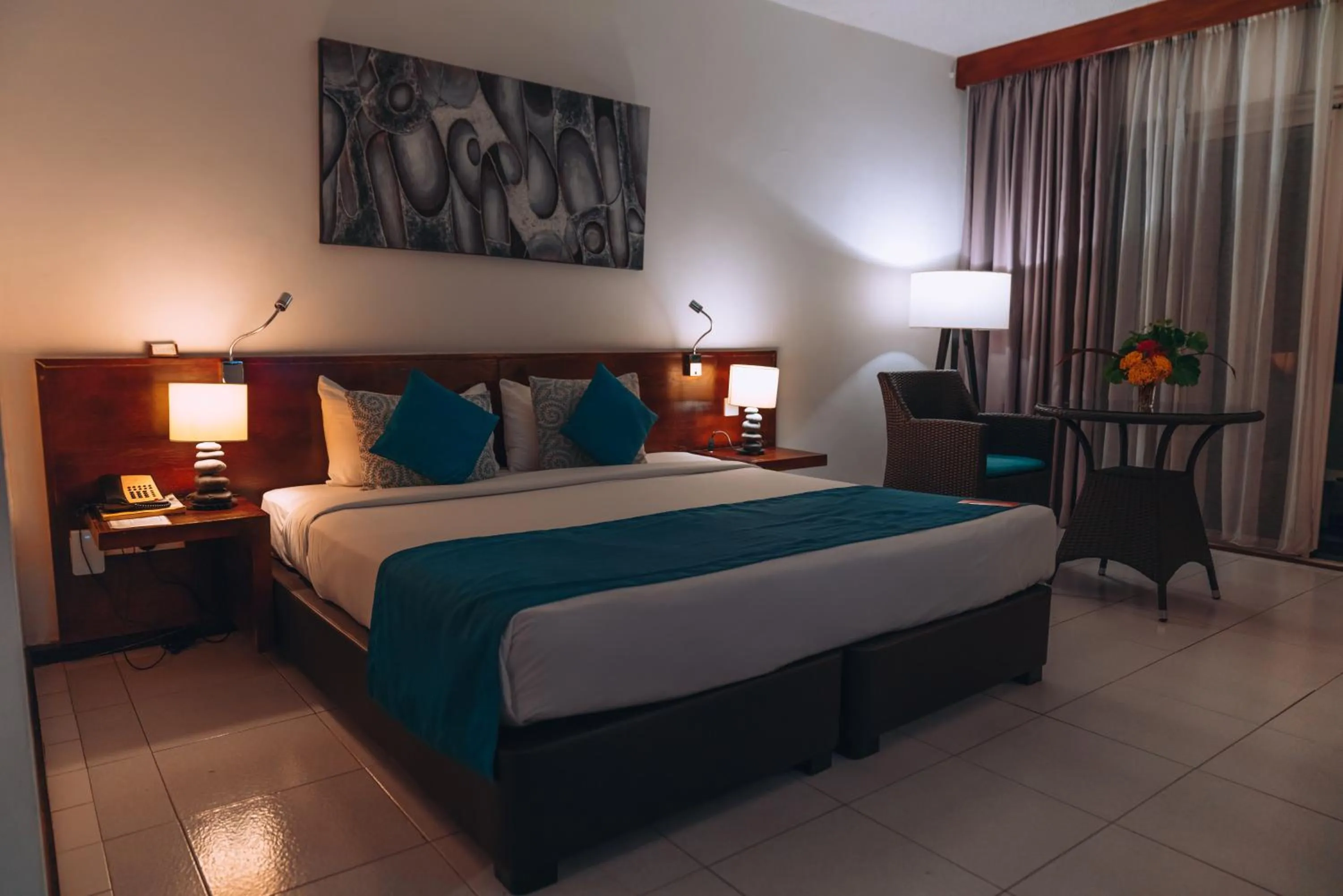Bed in Casuarina Resort and Spa