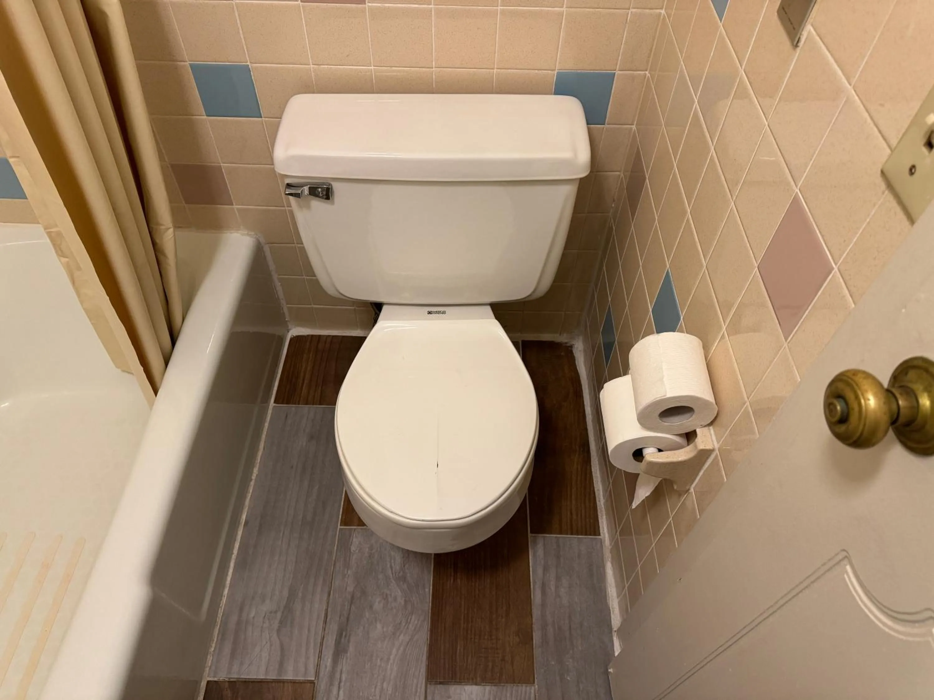 Toilet in Country Club Inn & Suites