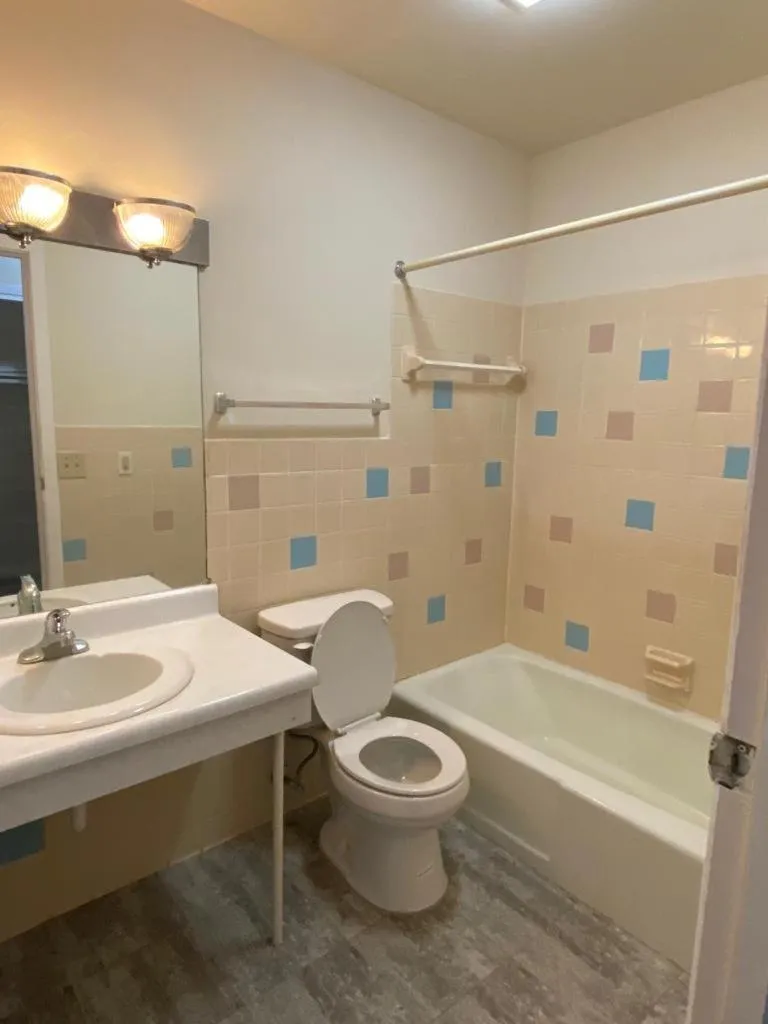 Toilet in Country Club Inn & Suites