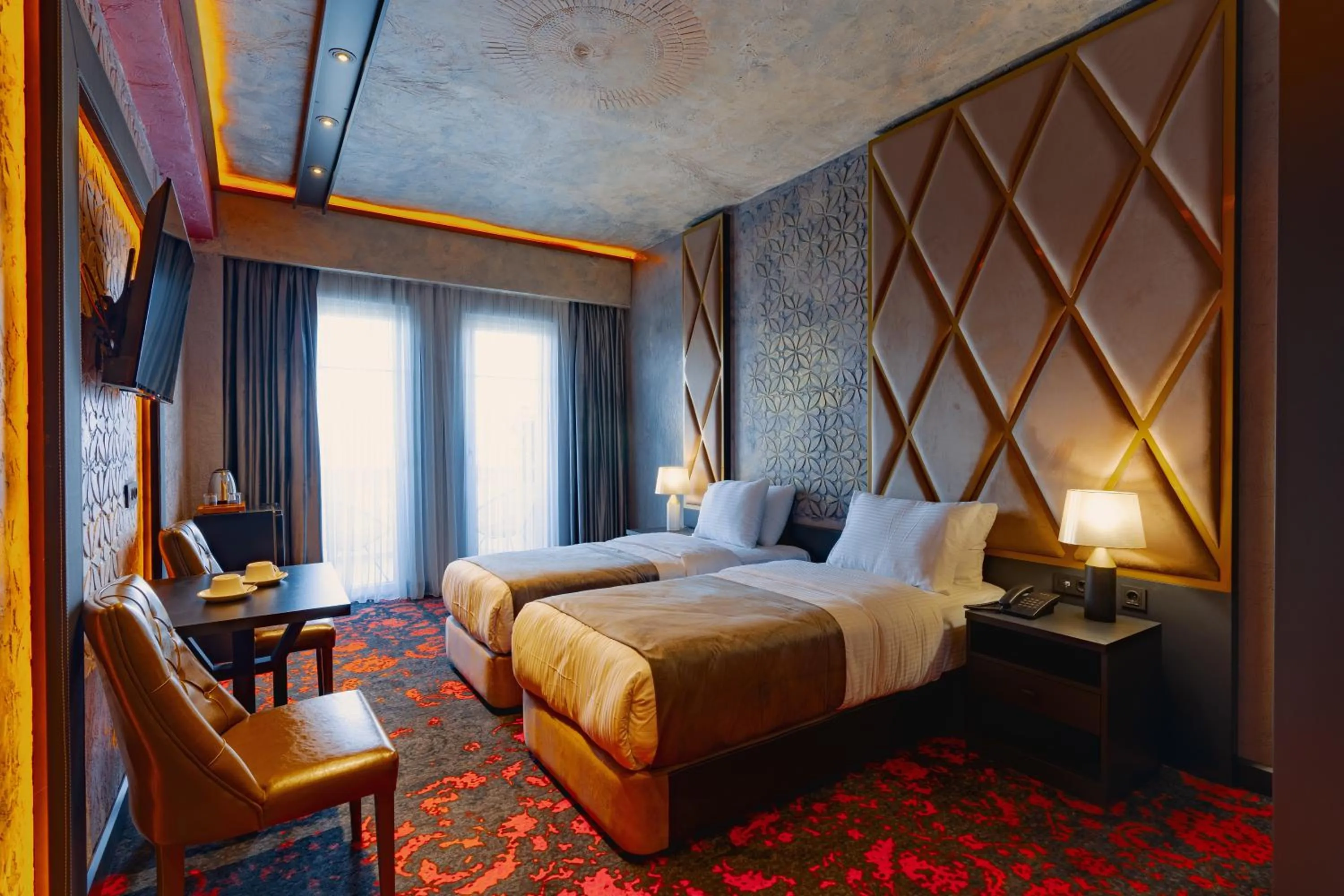 Bed in Tapis Rouge Design Boutique Hotel