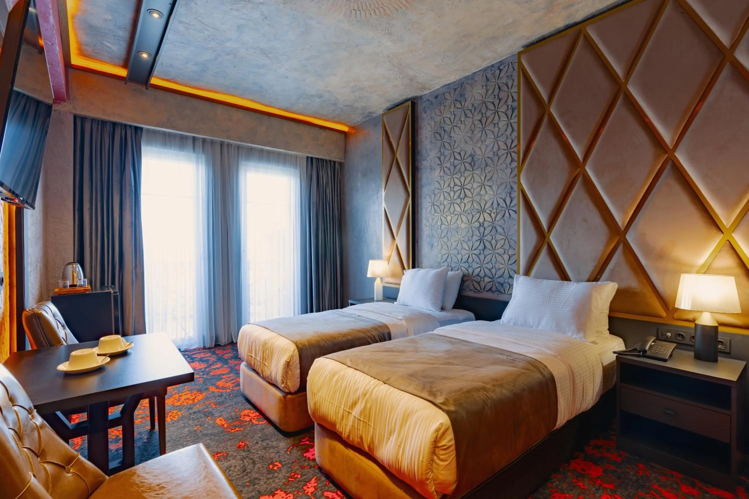 Bed in Tapis Rouge Design Boutique Hotel