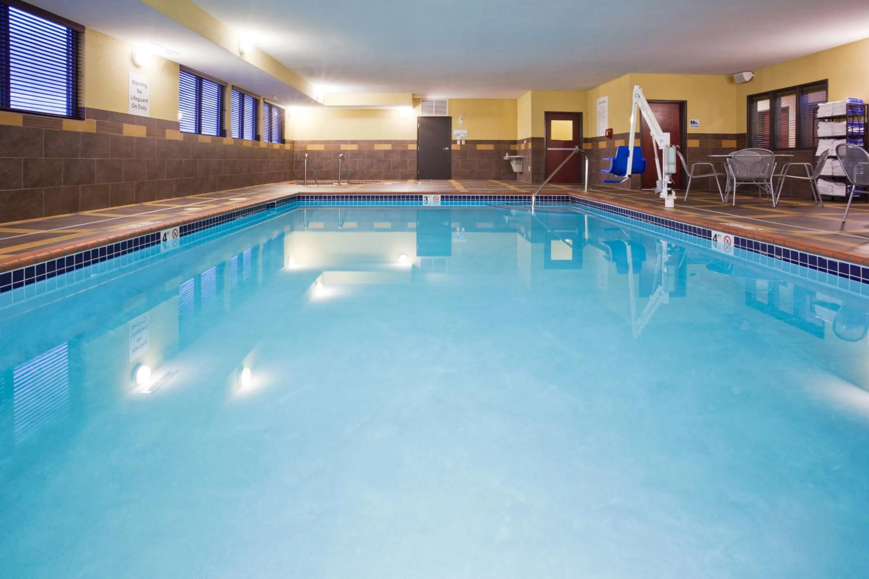 Swimming pool in Holiday Inn Express and Suites Rochester West-Medical Center by IHG