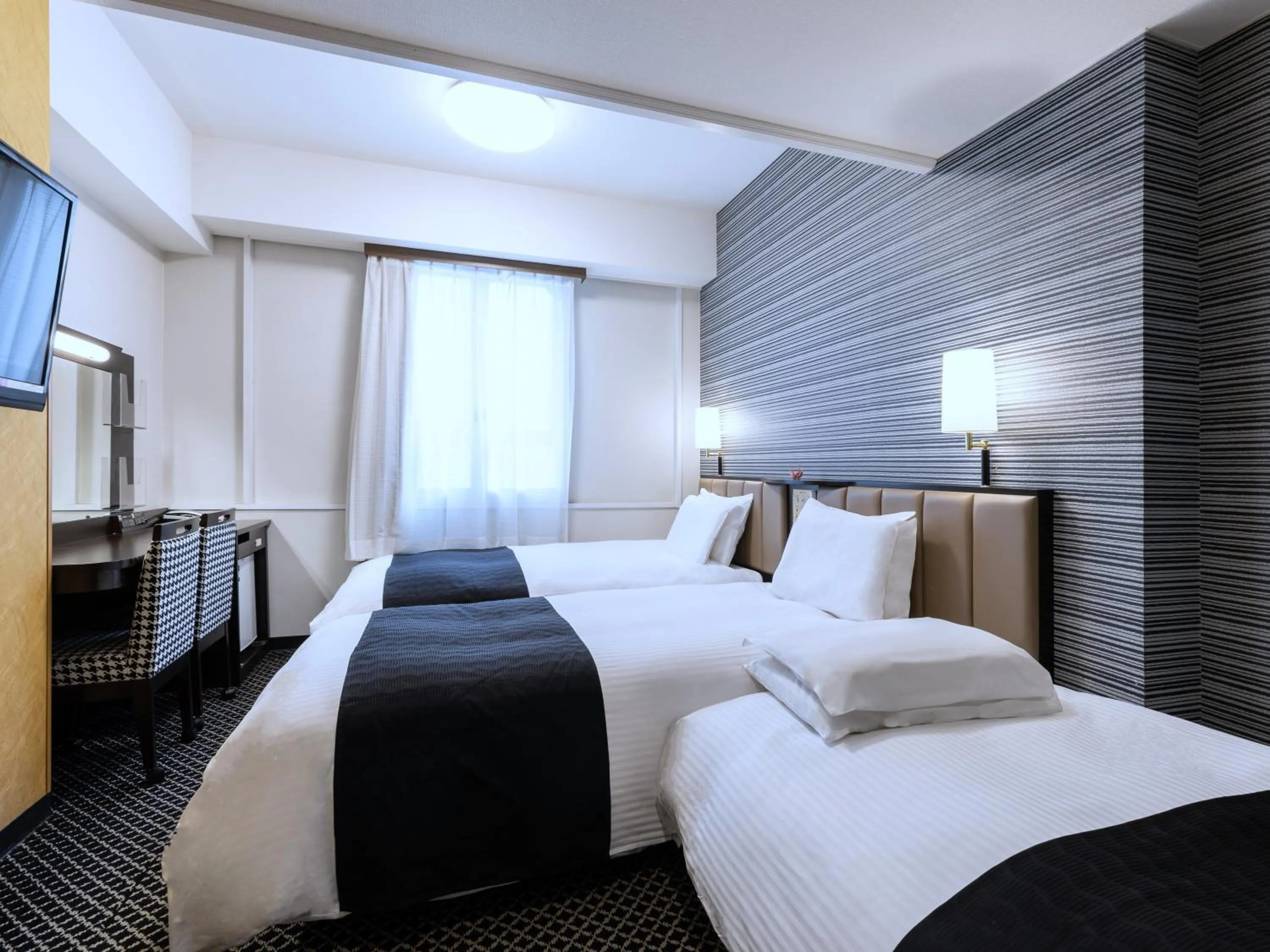 Photo of the whole room, Bed in APA Hotel Sapporo Susukino Ekimae