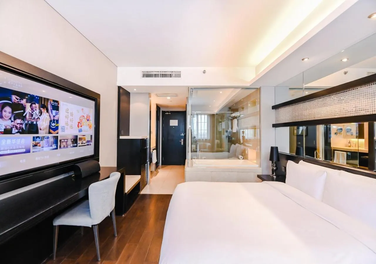 Communal lounge/ TV room, Bed in Crystal Orange Hotel Shanghai Kangqiao Branch