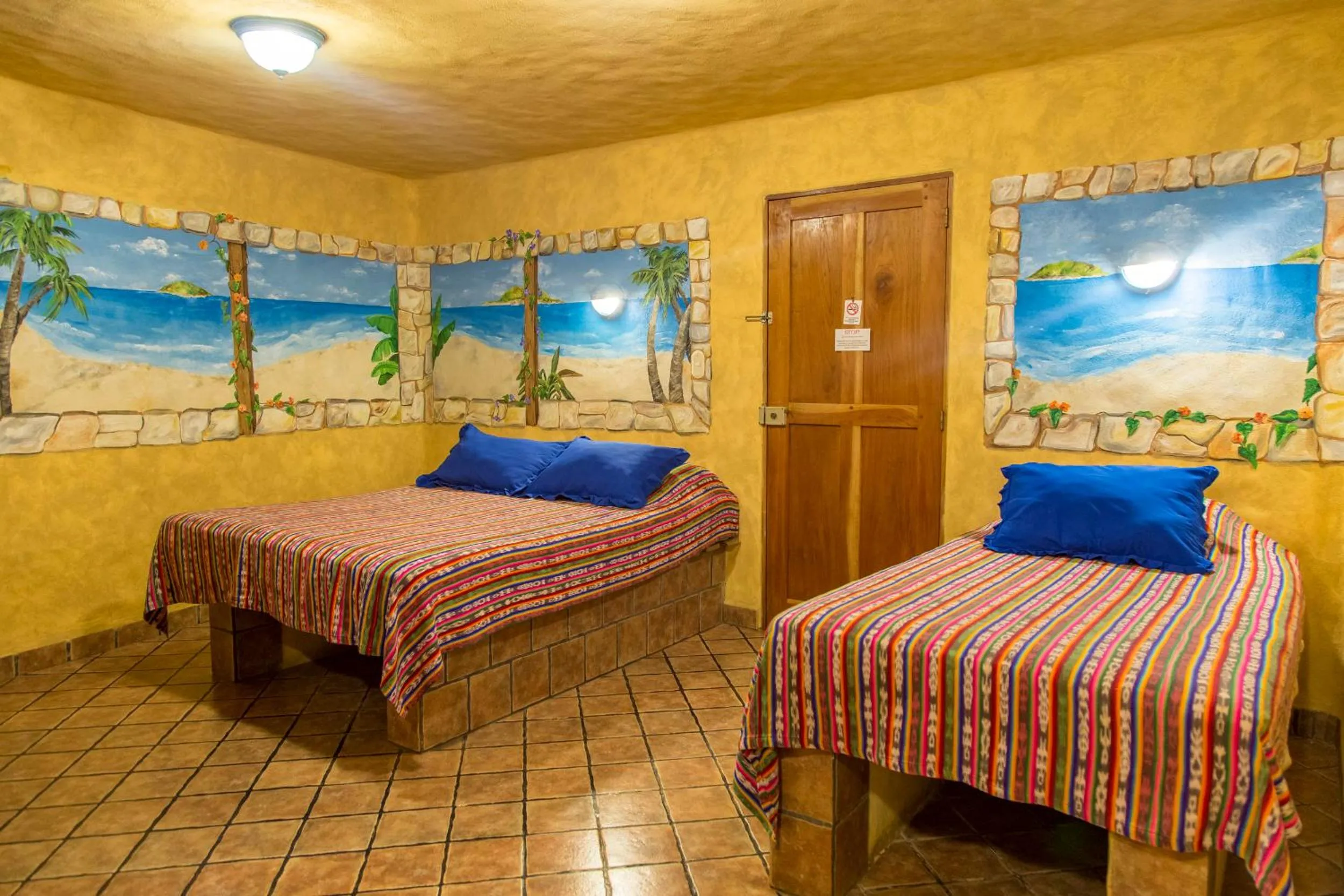 Bed in El Sano Banano Beachside Hotel