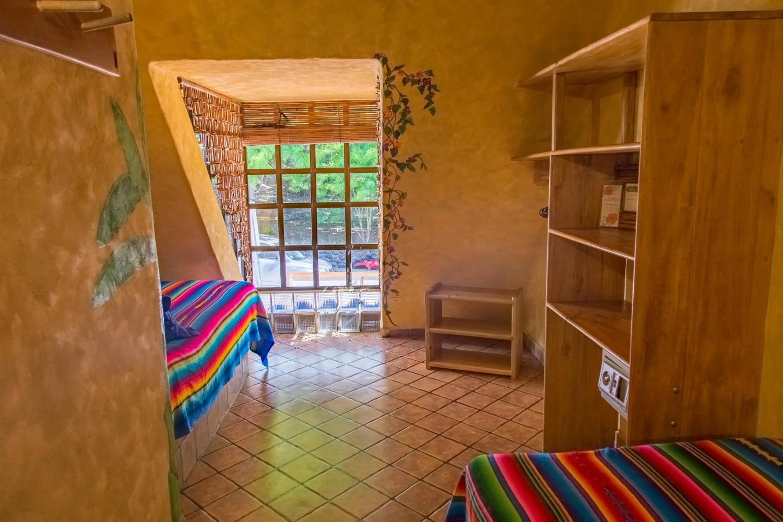 Bed in El Sano Banano Beachside Hotel