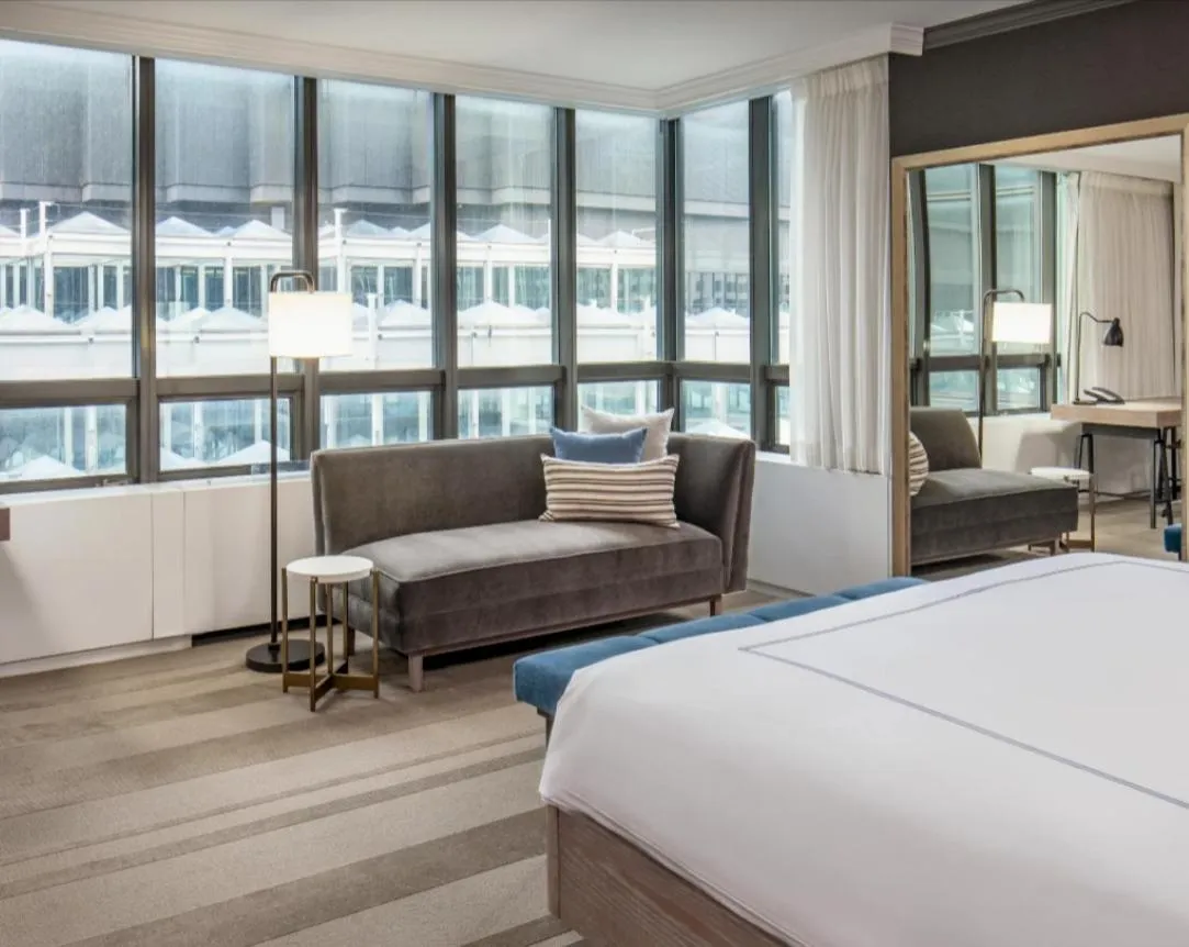 Living room, Bed in The Marquette Hotel, Curio Collection by Hilton