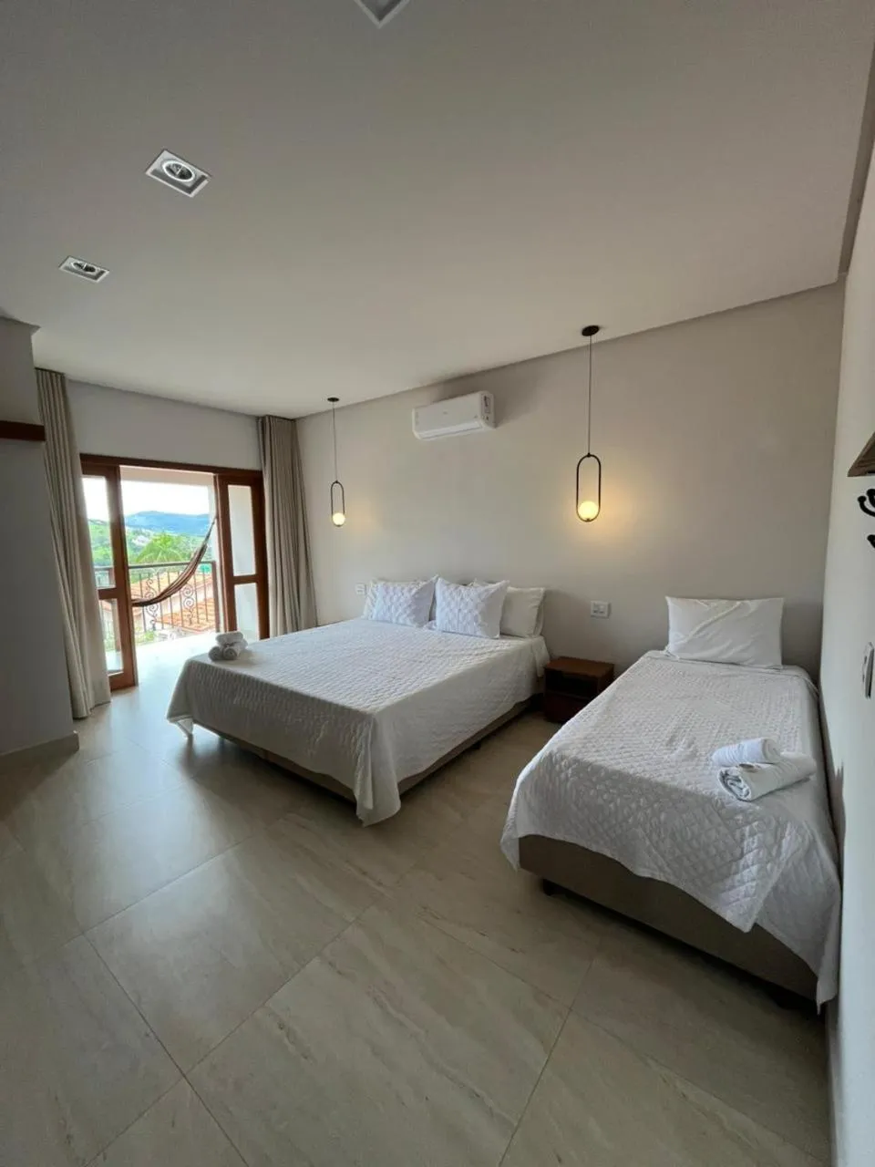 Bed in Pousada Quintal da Lua