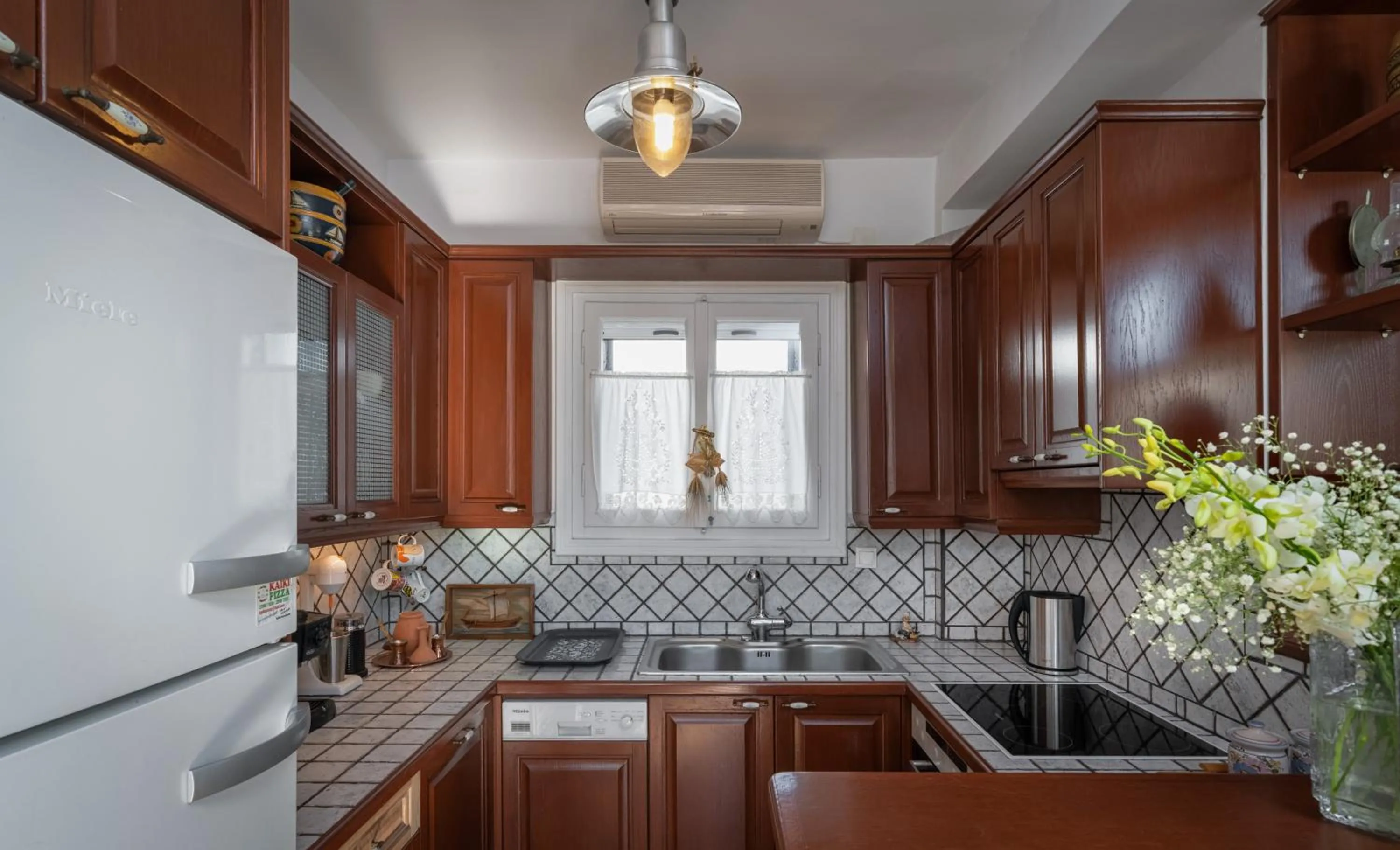 Kitchen or kitchenette in Porto Vecchio Luxury Suites