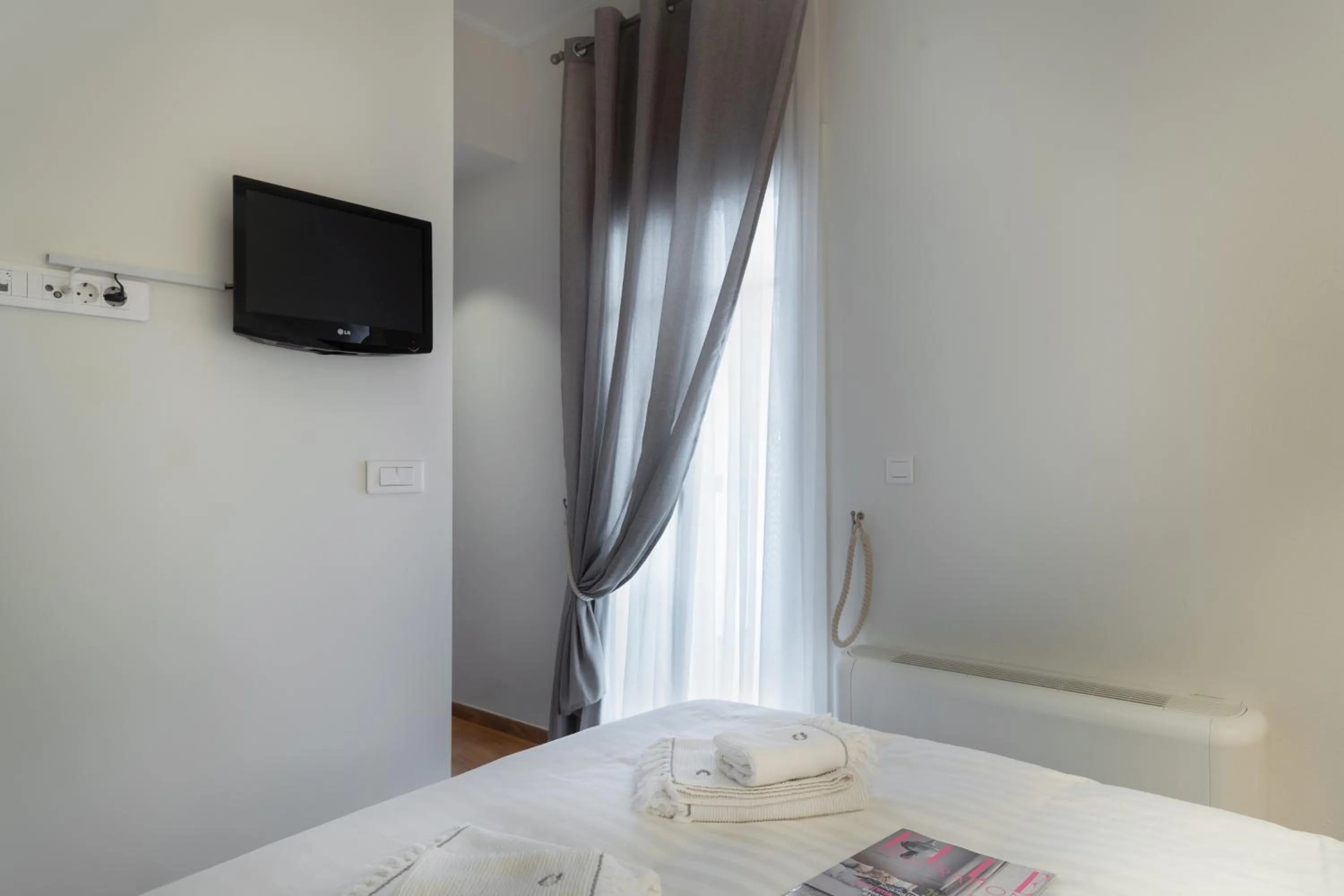 Bed in Porto Vecchio Luxury Suites