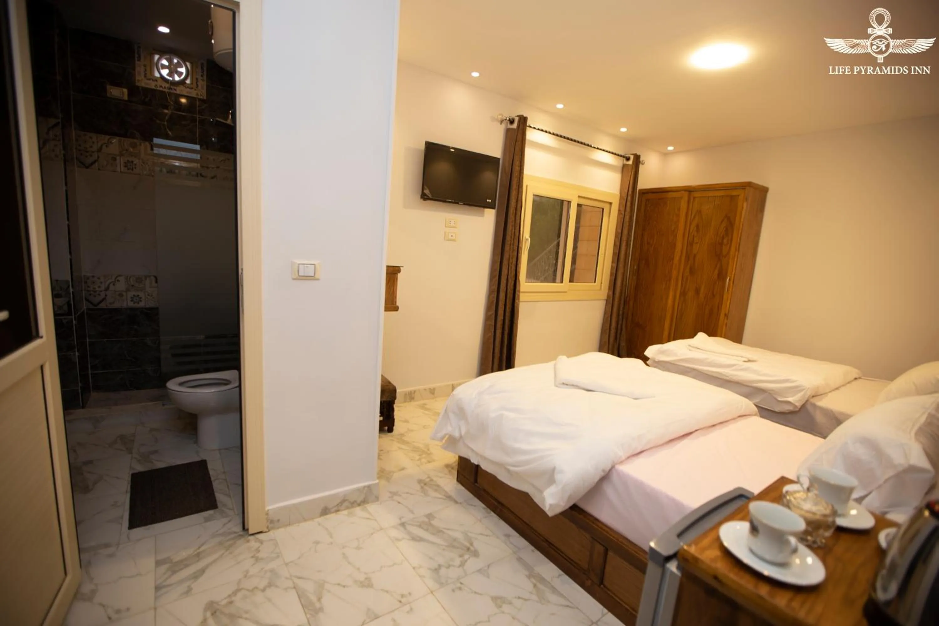 Toilet, Bed in Life Pyramids Inn