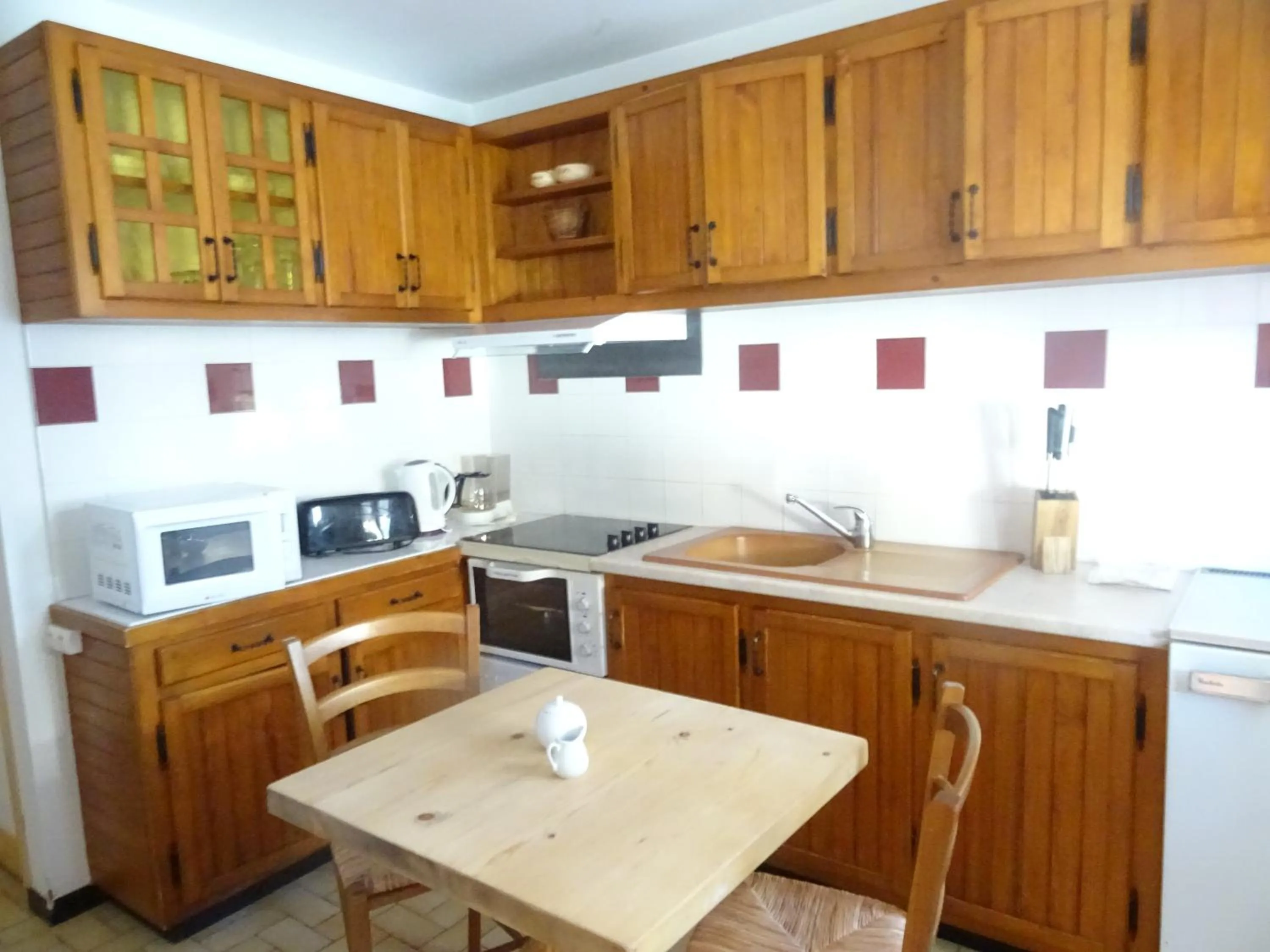 Kitchen or kitchenette in Apart'hotel & Spa "La Destière"