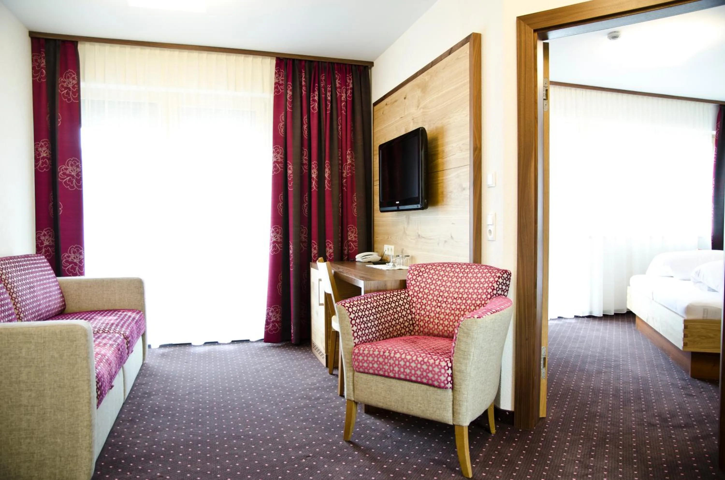 Living room, Bed in Hotel Garni Arosa