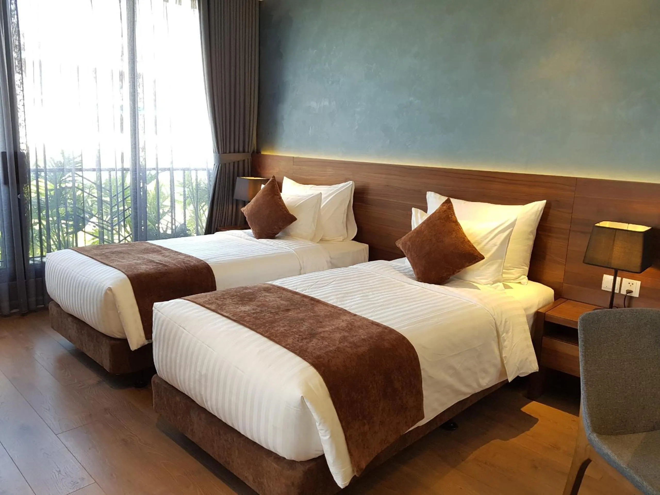 Bed in Orchid Boutique Hotel & Apartment
