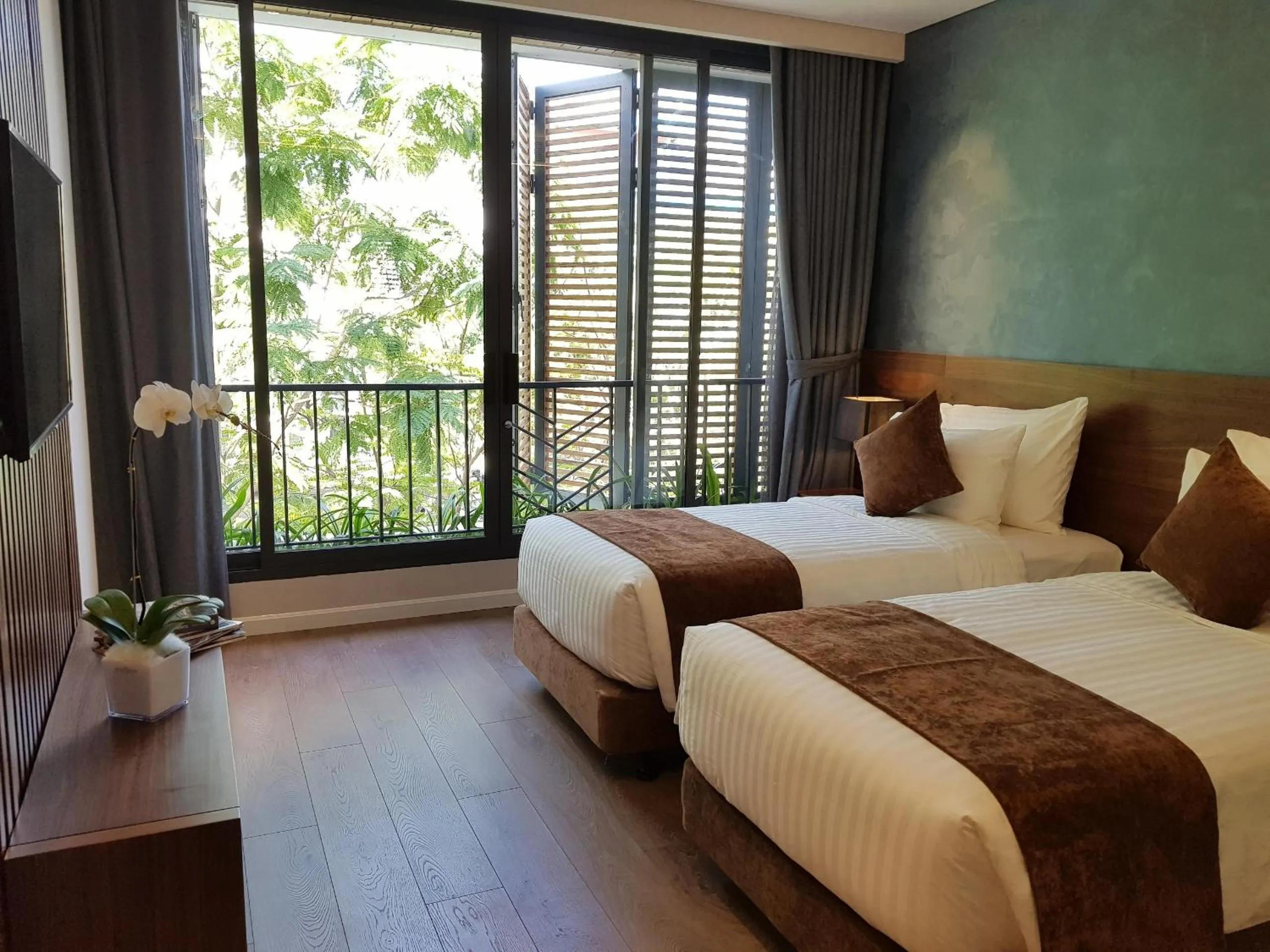 Bed in Orchid Boutique Hotel & Apartment