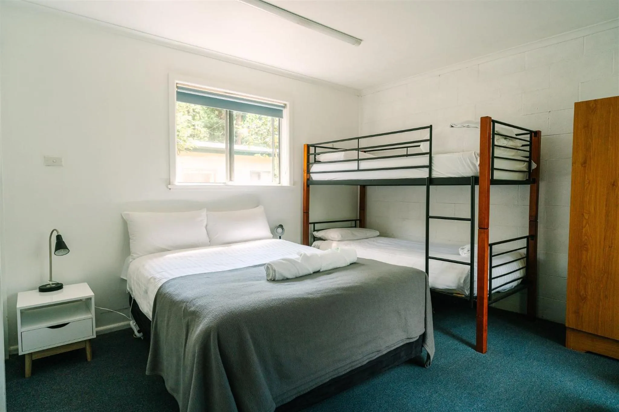 Bed in Alpine Riverside Cottages