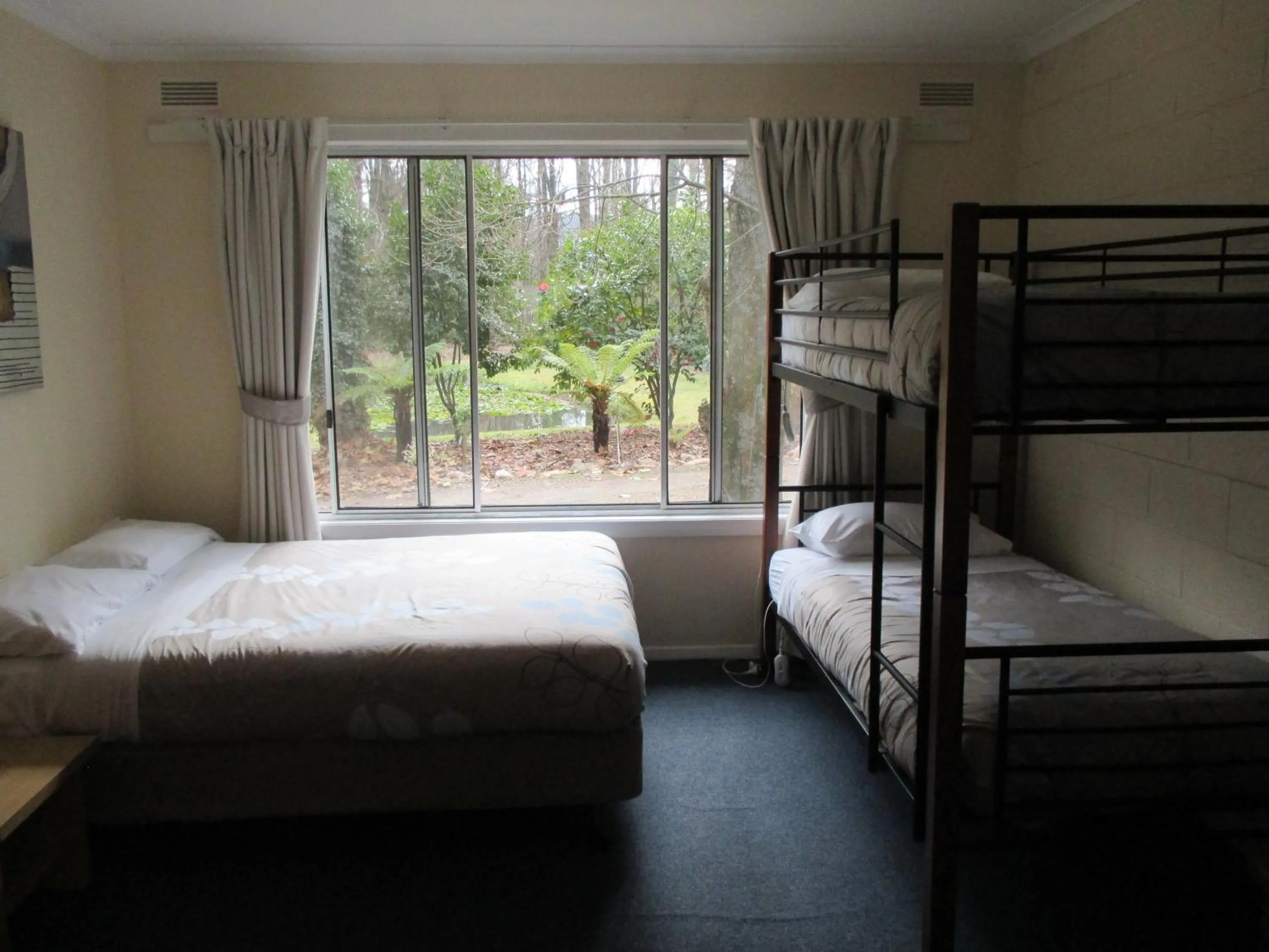 Bed in Alpine Riverside Cottages