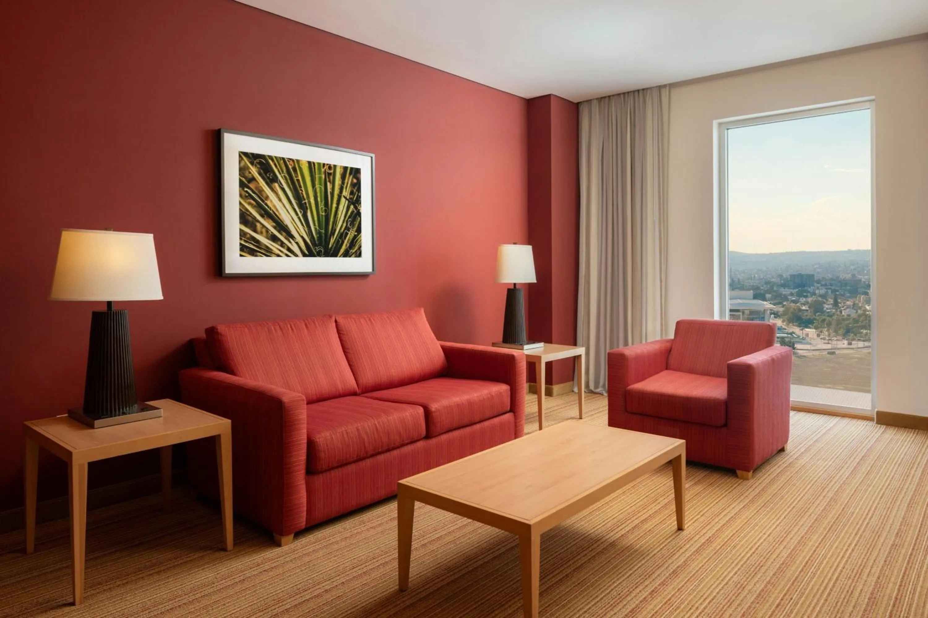 Living room in Courtyard by Marriott Leon at The Poliforum