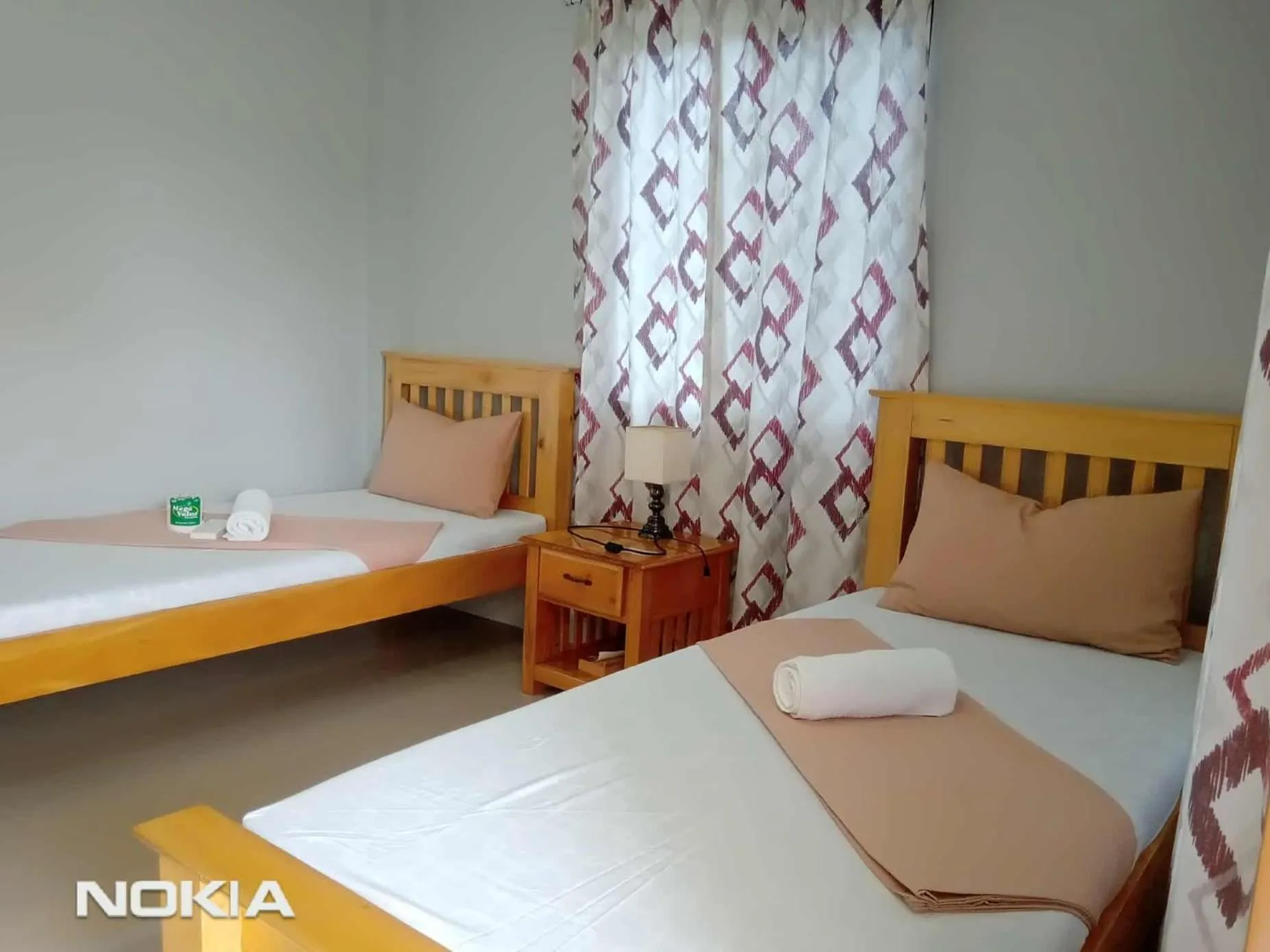 Bed in Grae’s Apartelle