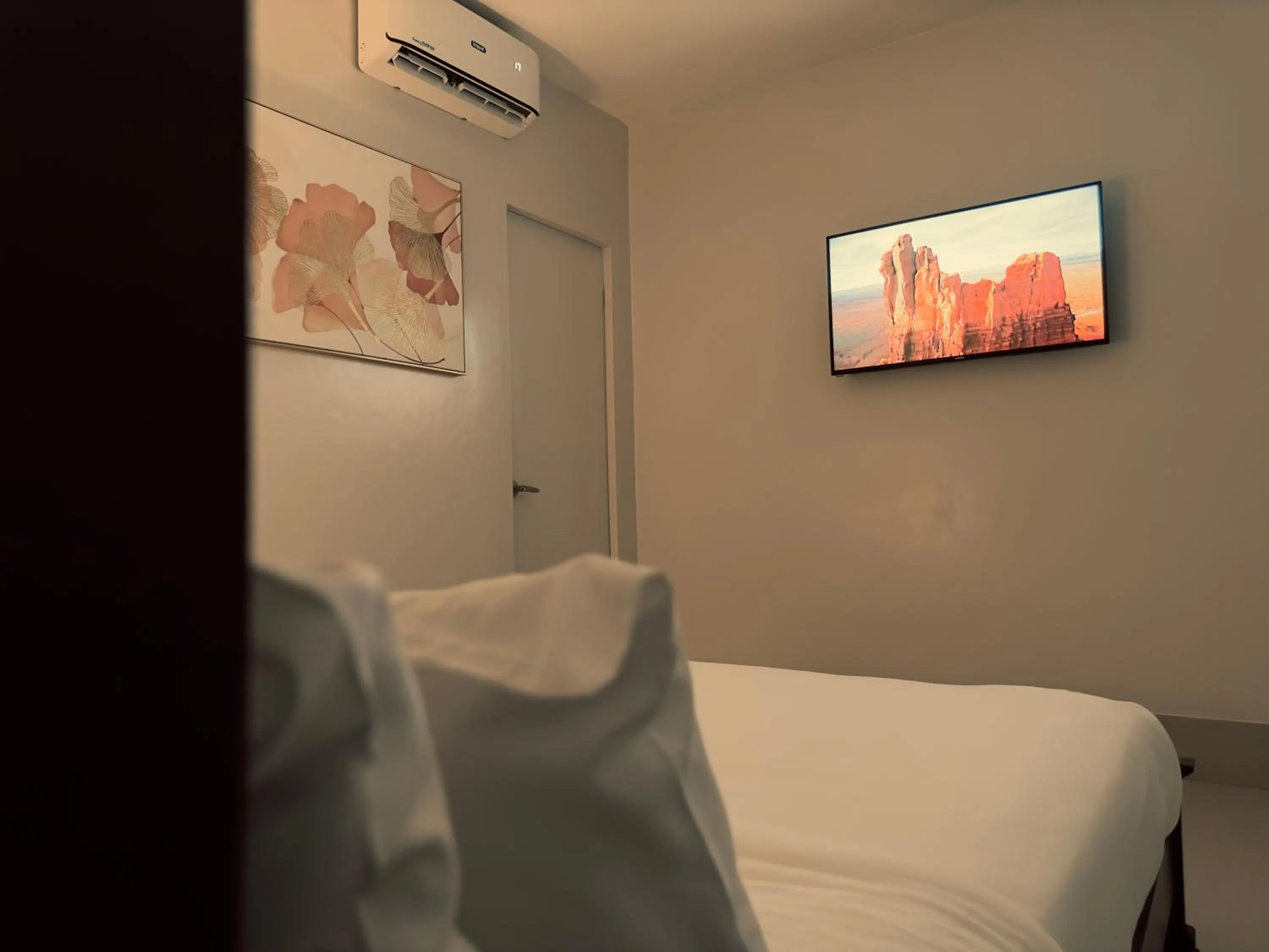 Bed in HARMAN SUITES Moalboal