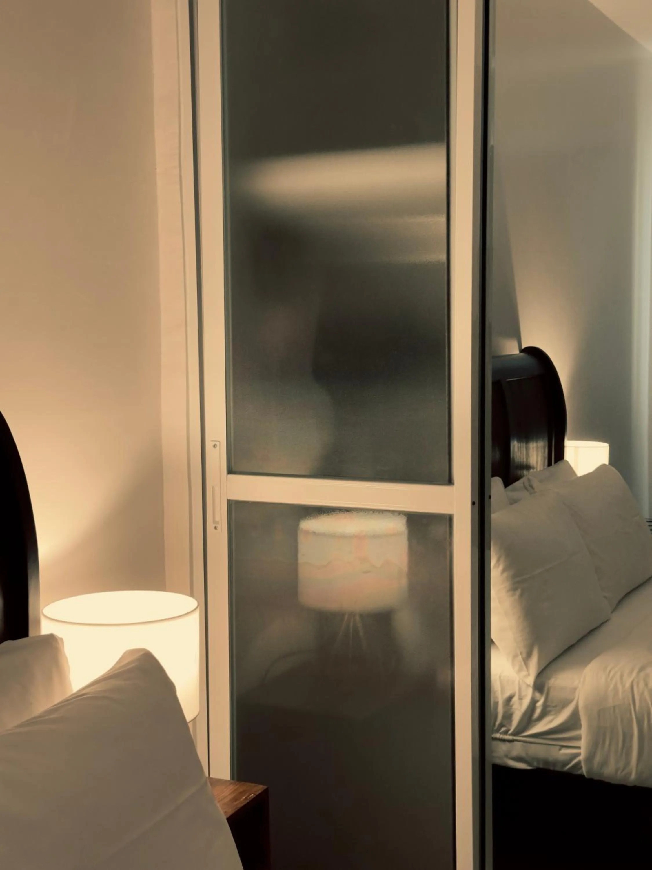 Bed in HARMAN SUITES Moalboal