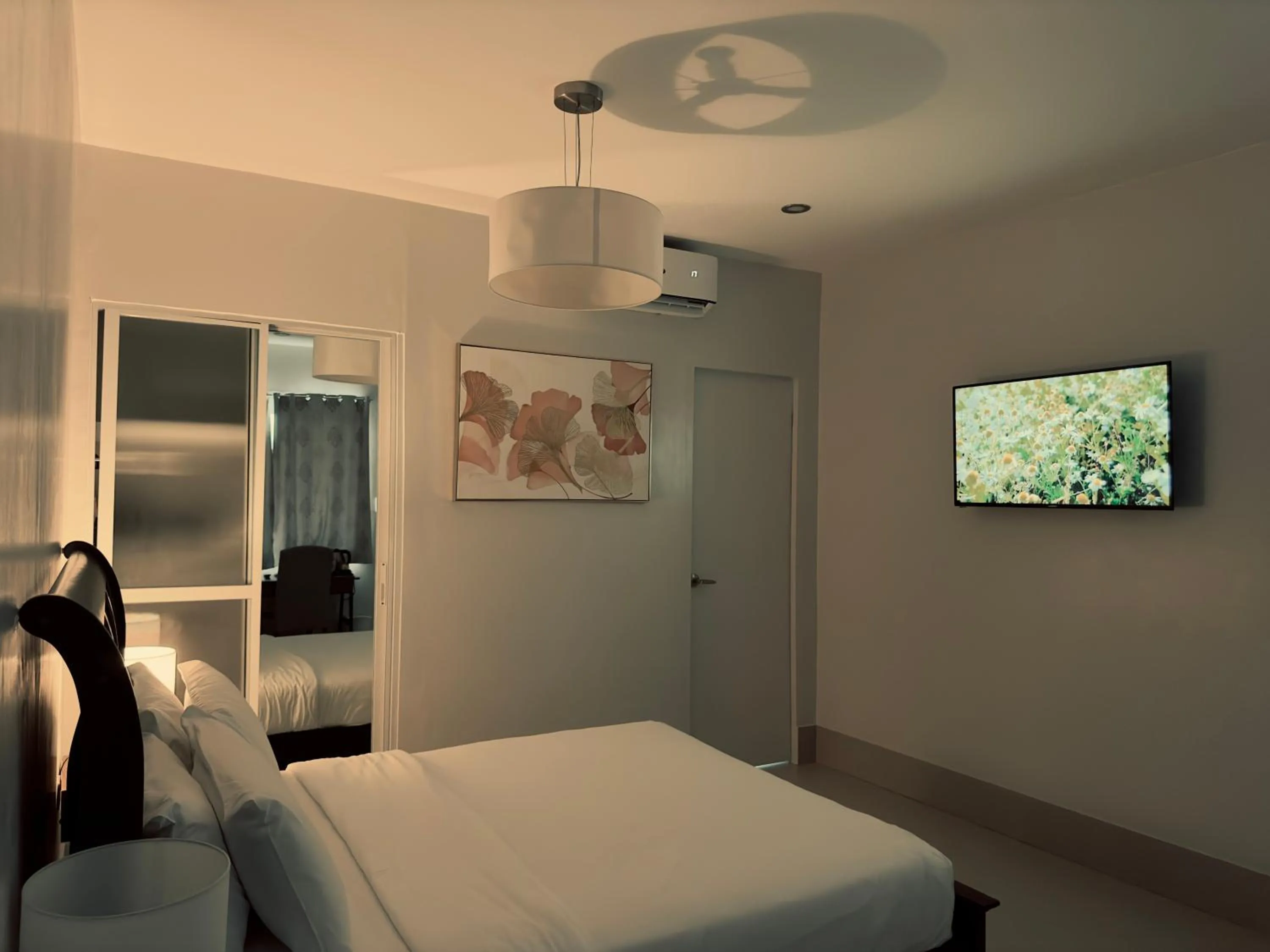 Bed in HARMAN SUITES Moalboal