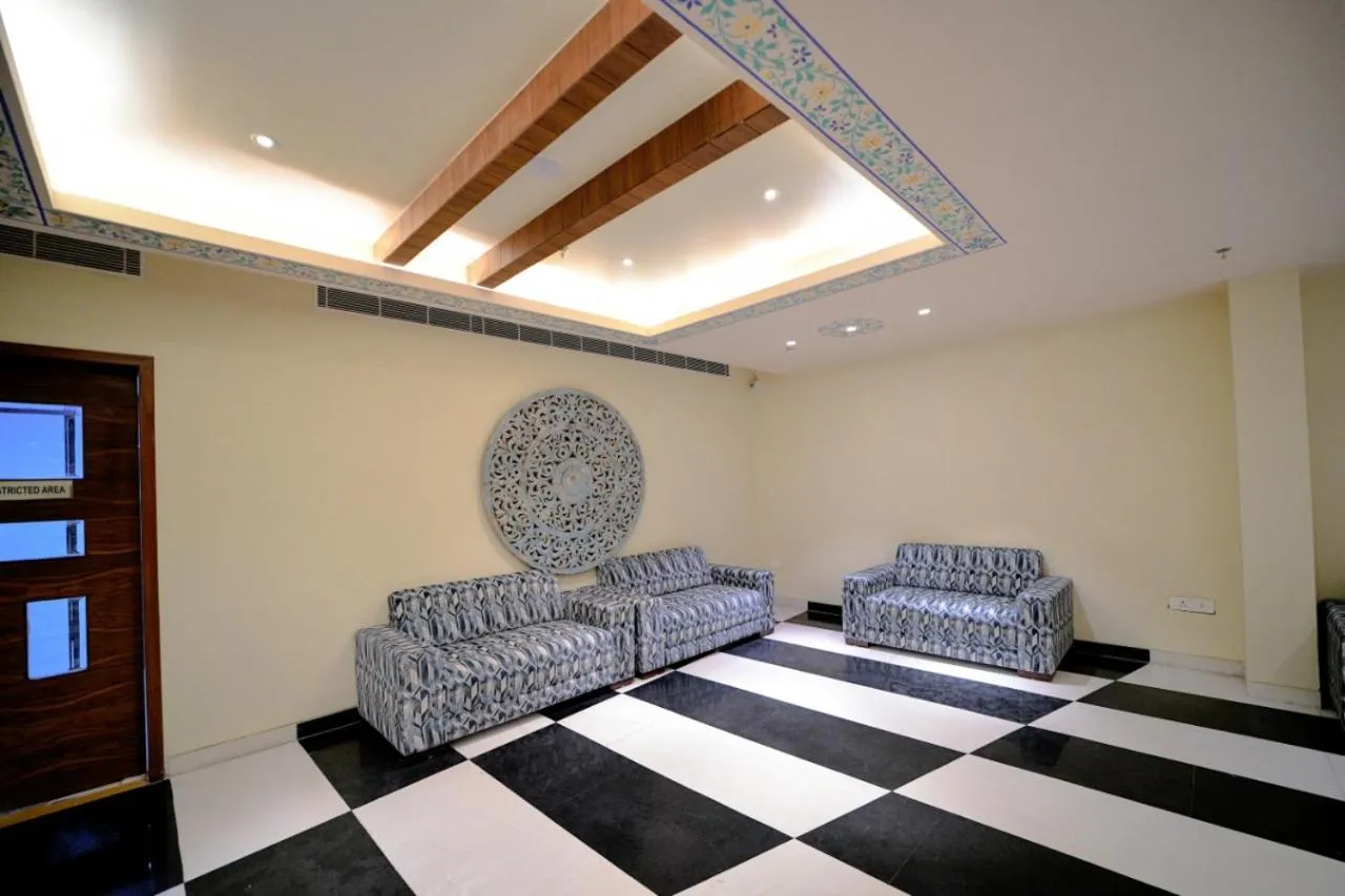 Seating area, Bed in The Ramvilas - A Rooftop Pichola Lake View Hotel