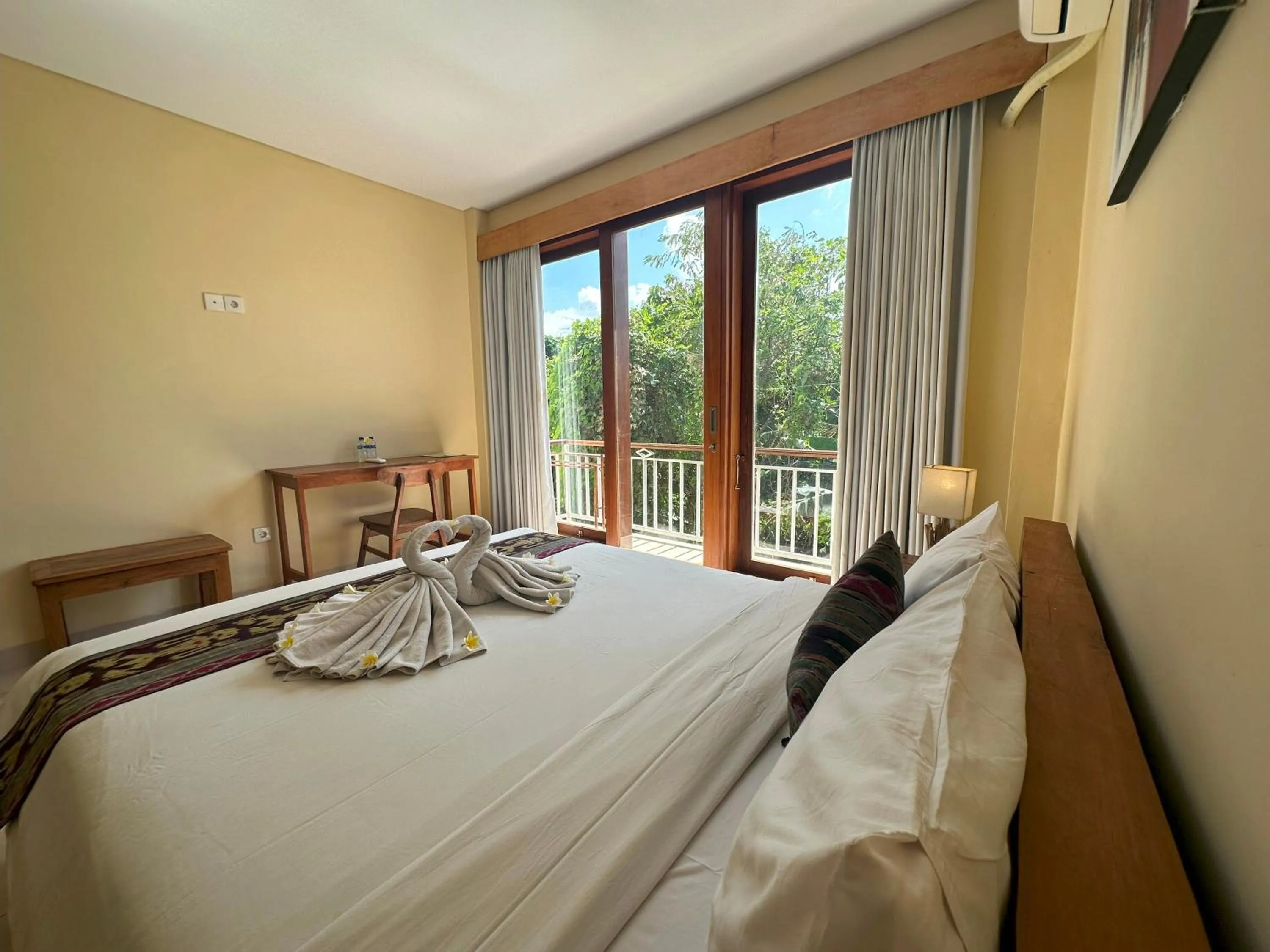 Bed in Oka's Guest House Canggu