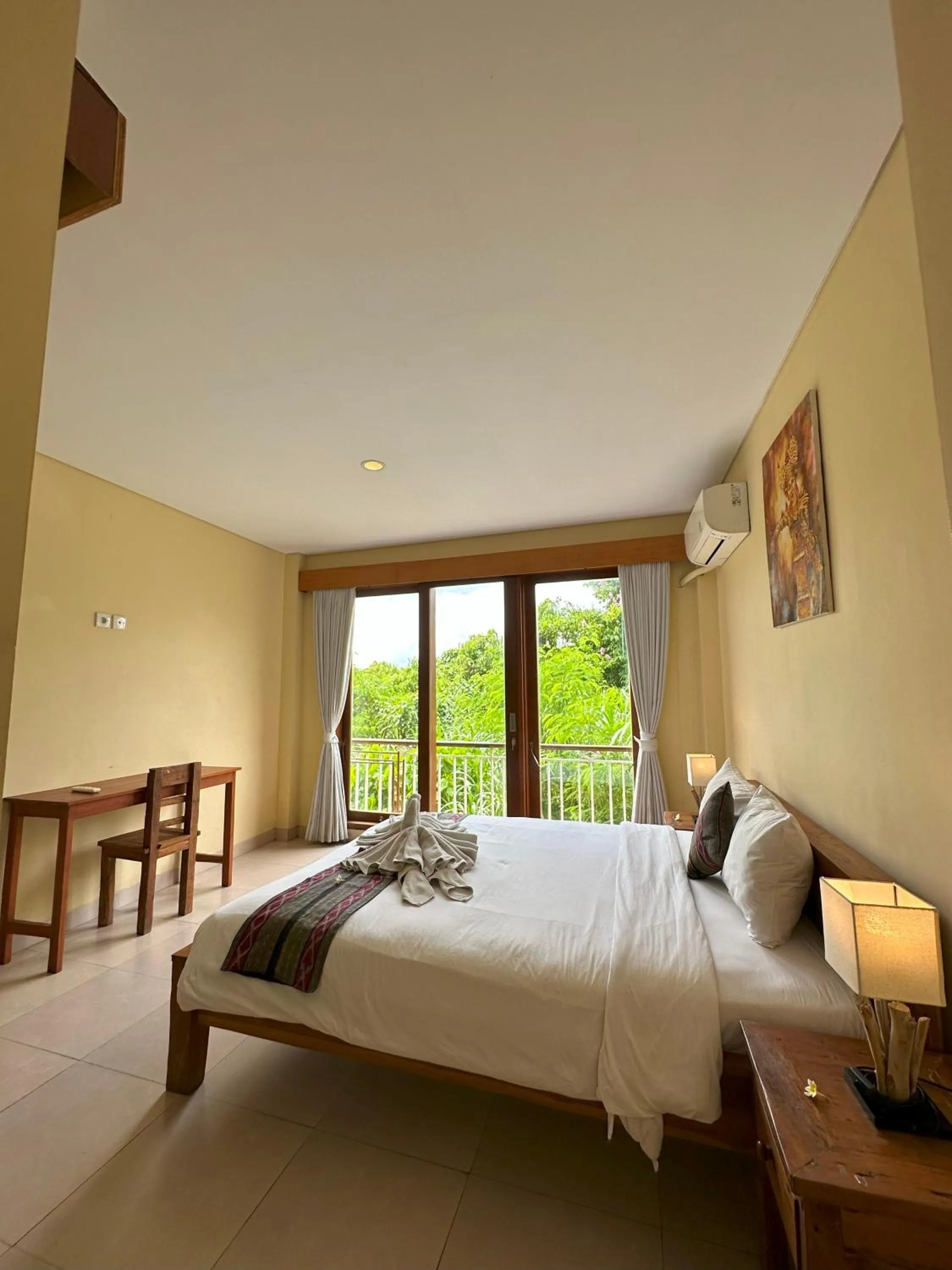 Bed in Oka's Guest House Canggu