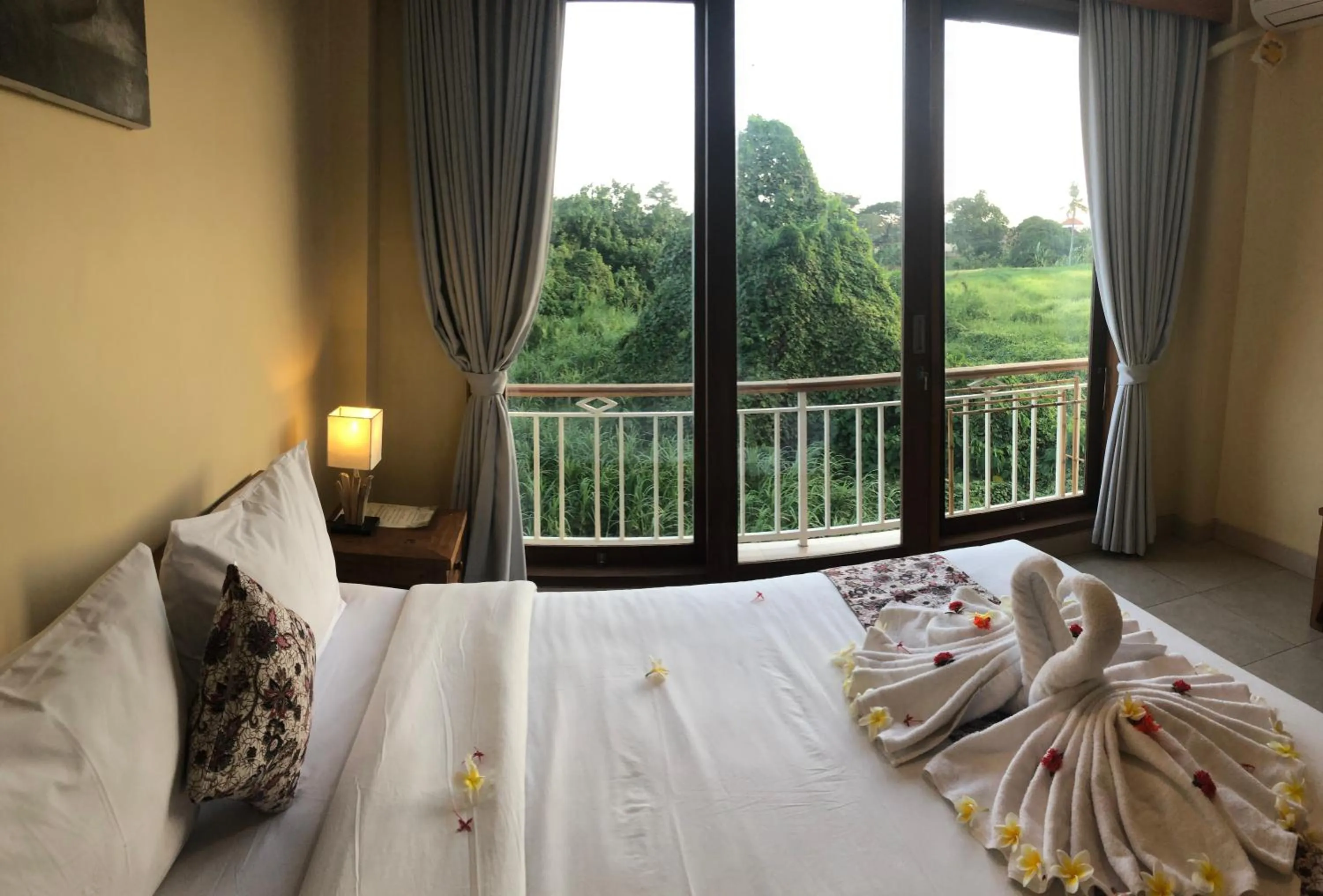 Bed in Oka's Guest House Canggu