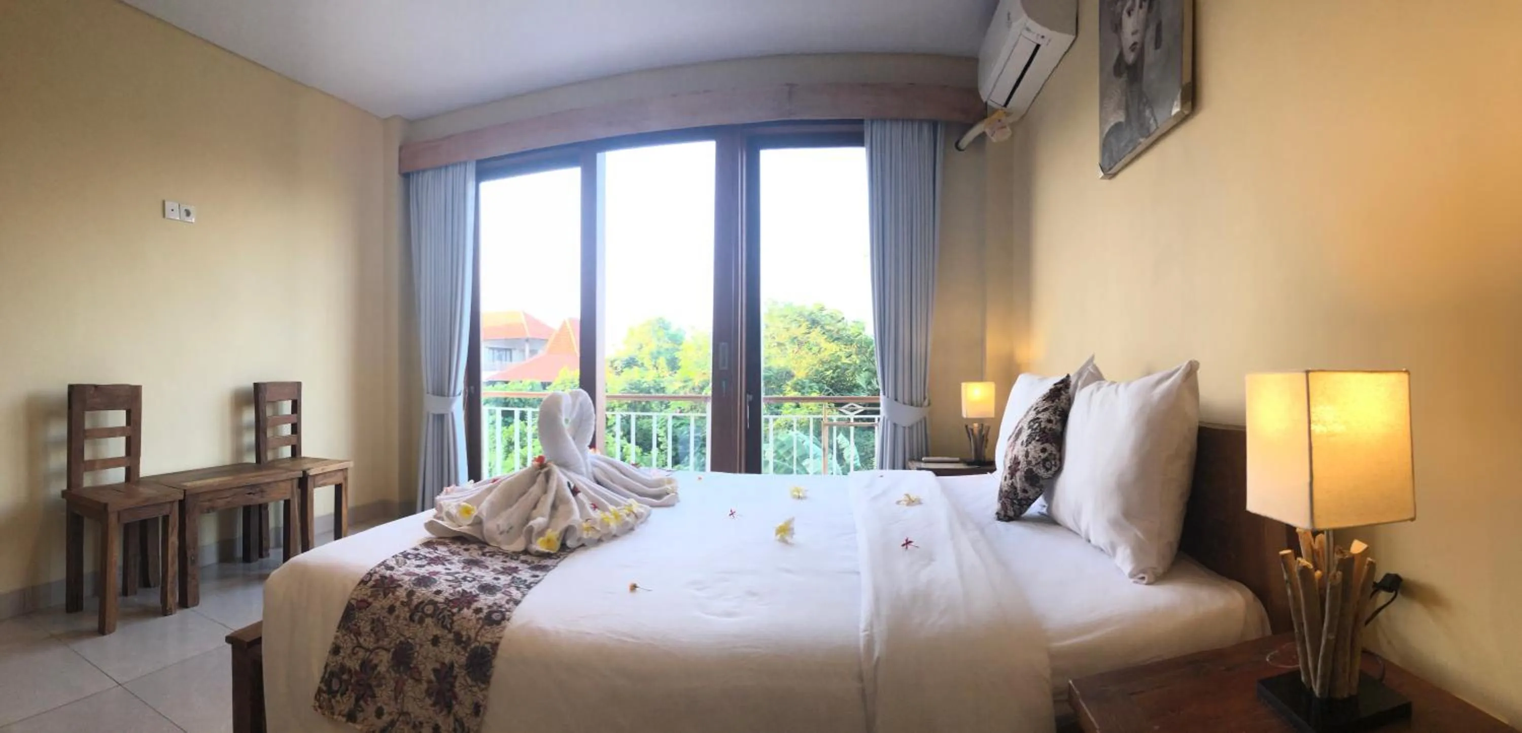 Bed in Oka's Guest House Canggu