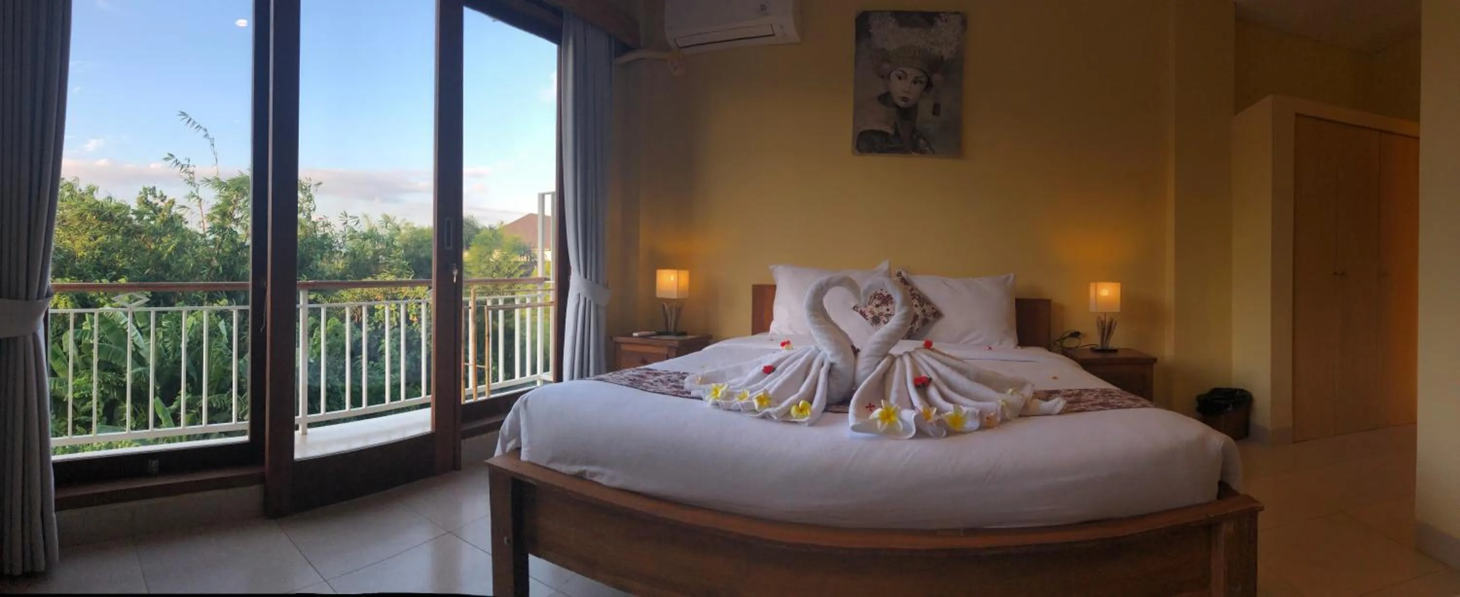 Bed in Oka's Guest House Canggu