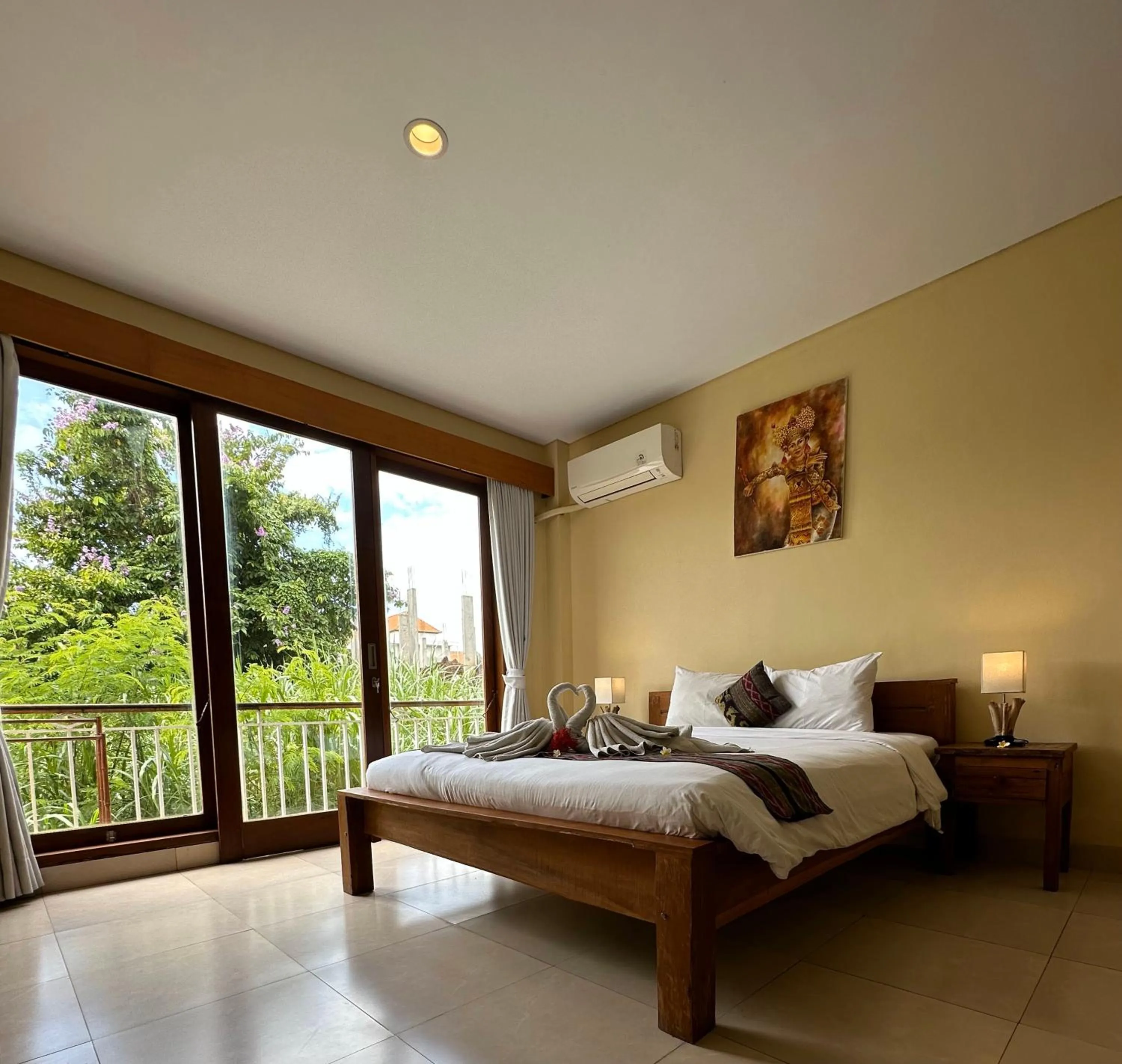 Bed in Oka's Guest House Canggu