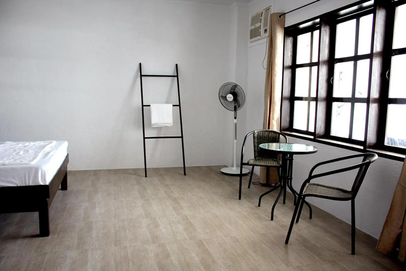 Bed in Sentro Suites Siargao