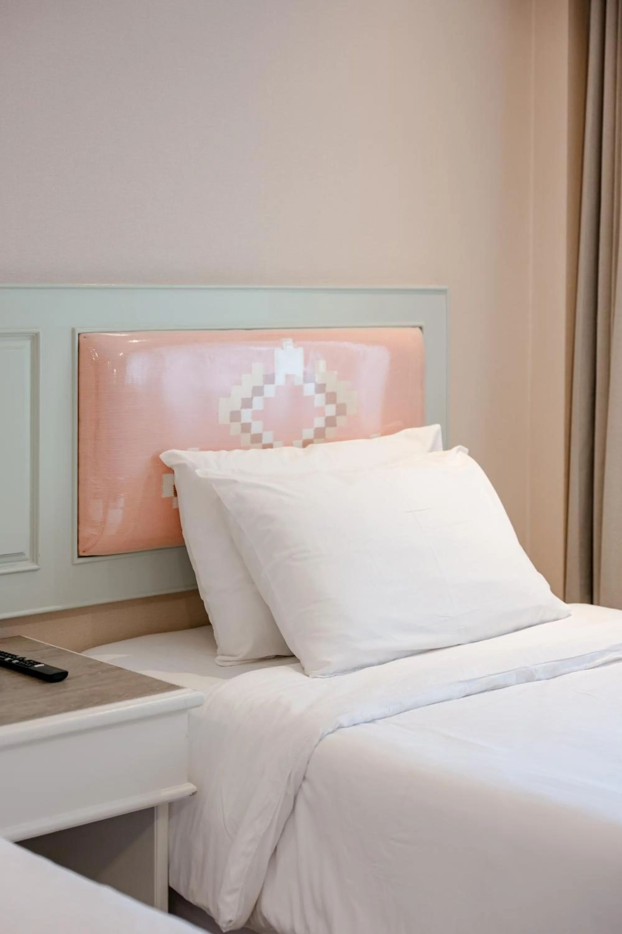 Bed in Dhevaraj Hotel