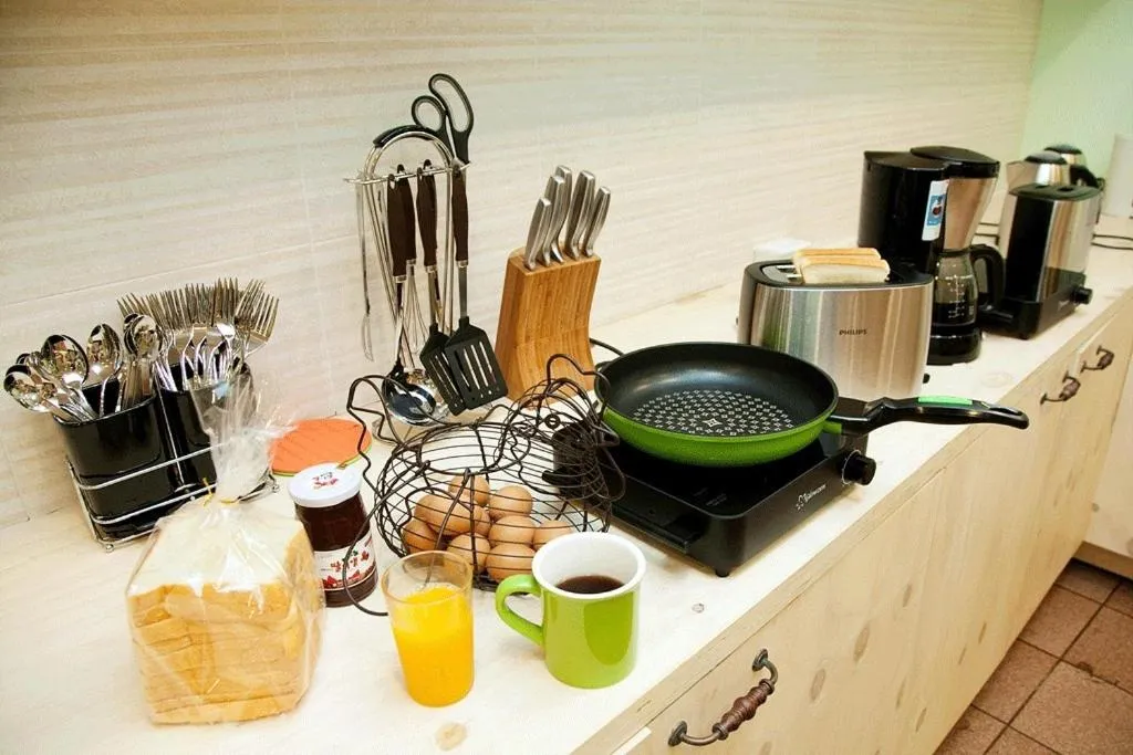 Communal lounge/ TV room in You&I Guesthouse