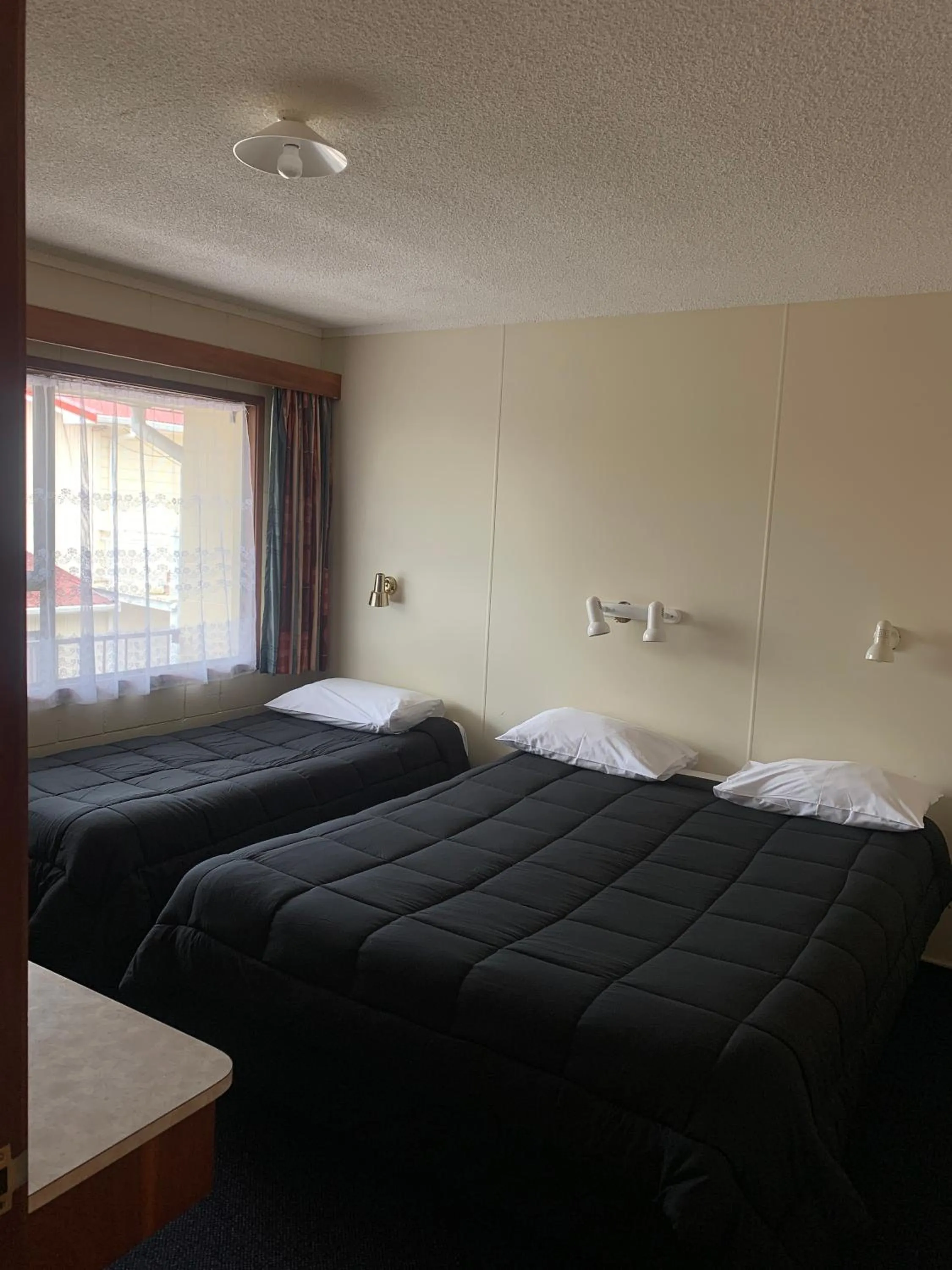 Bed in Wayfarer Motel