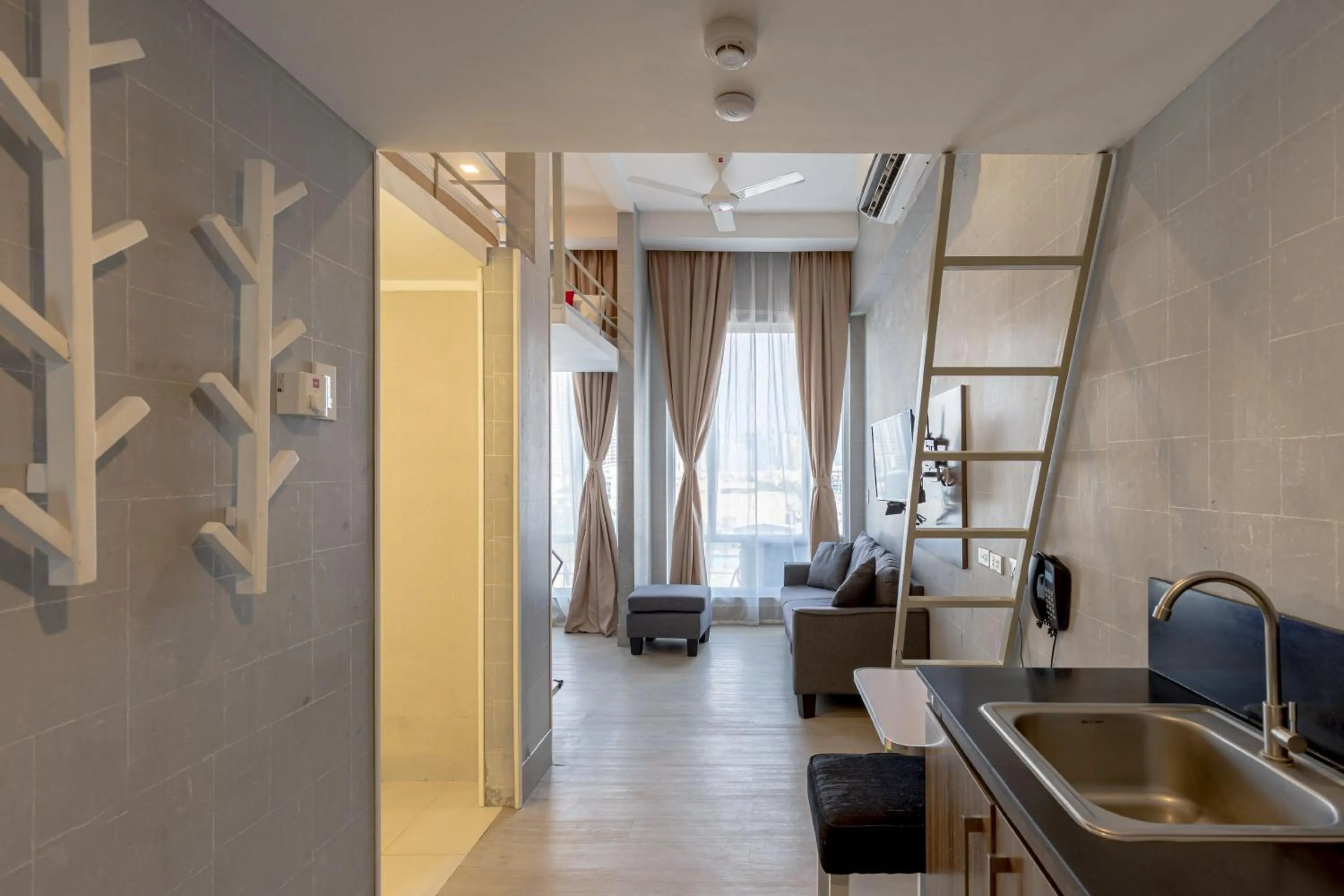 Seating area in Selah Pods Hotel Manila