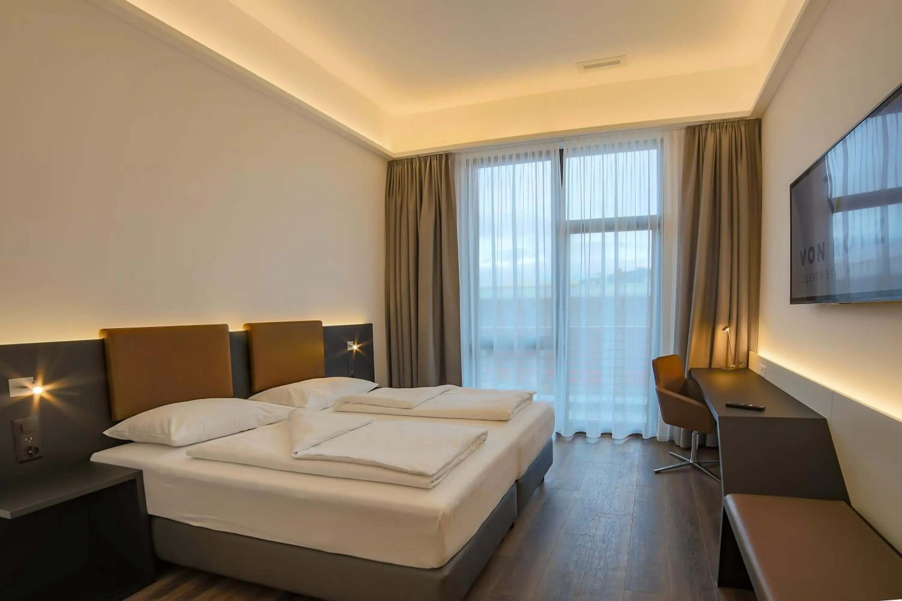 Bed in Self Check-in Hotel von Rotz