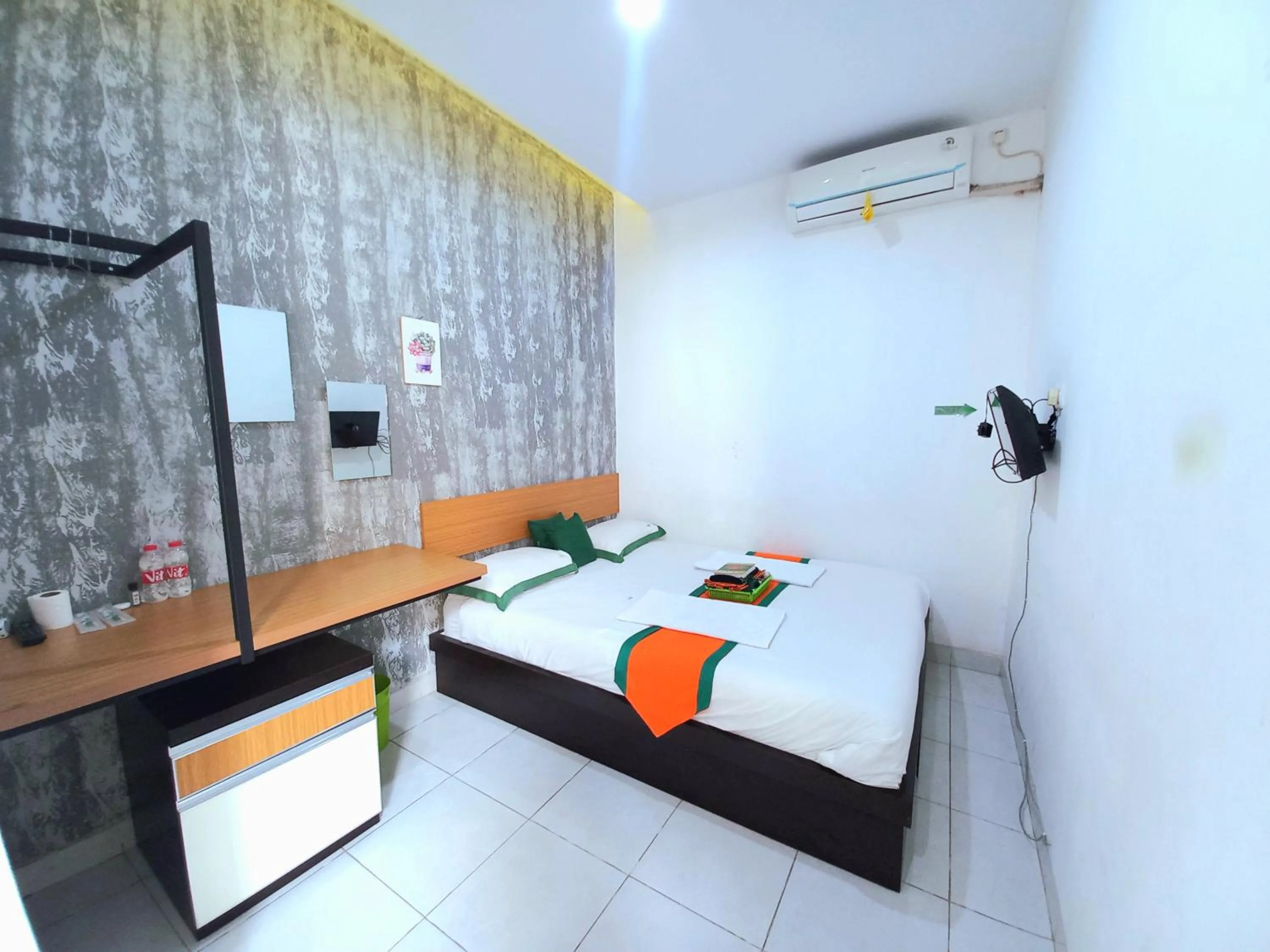 Bed in Hotel Jogja Kili Suci By Simply Homy
