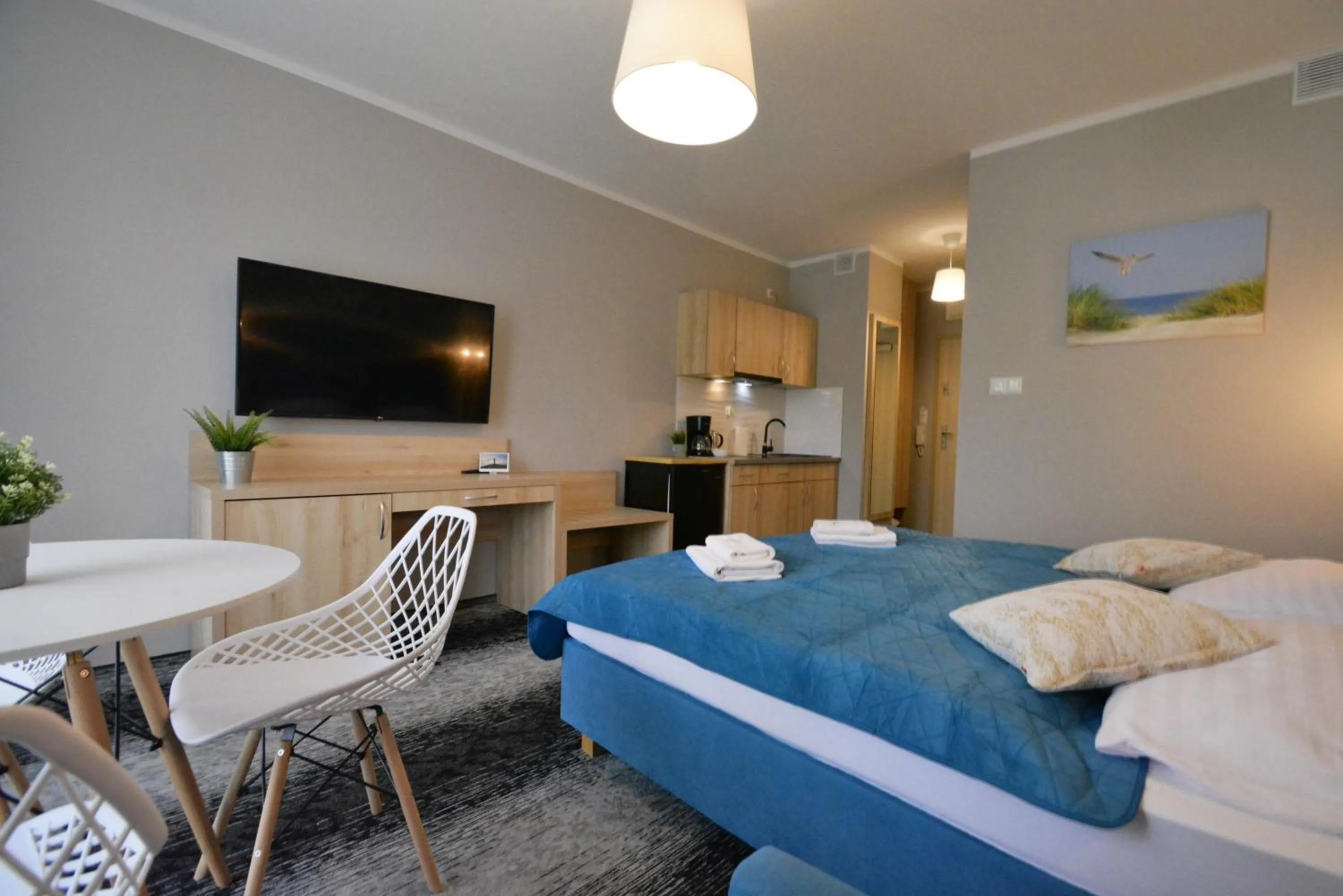 Seating area, Bed in Osiedle Cesarskie Apartamenty - Parking - Apartamenty Bryza