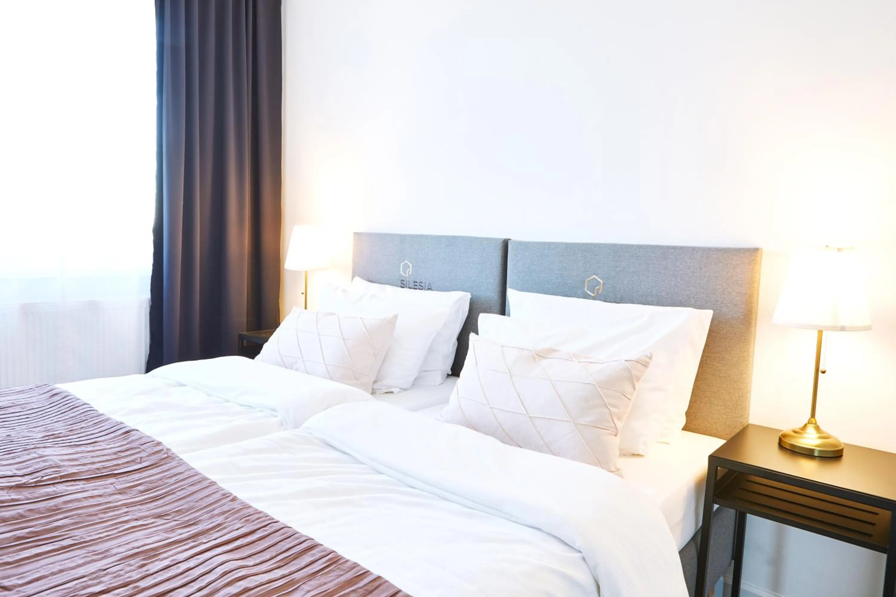 Bed in Silesia Apartments