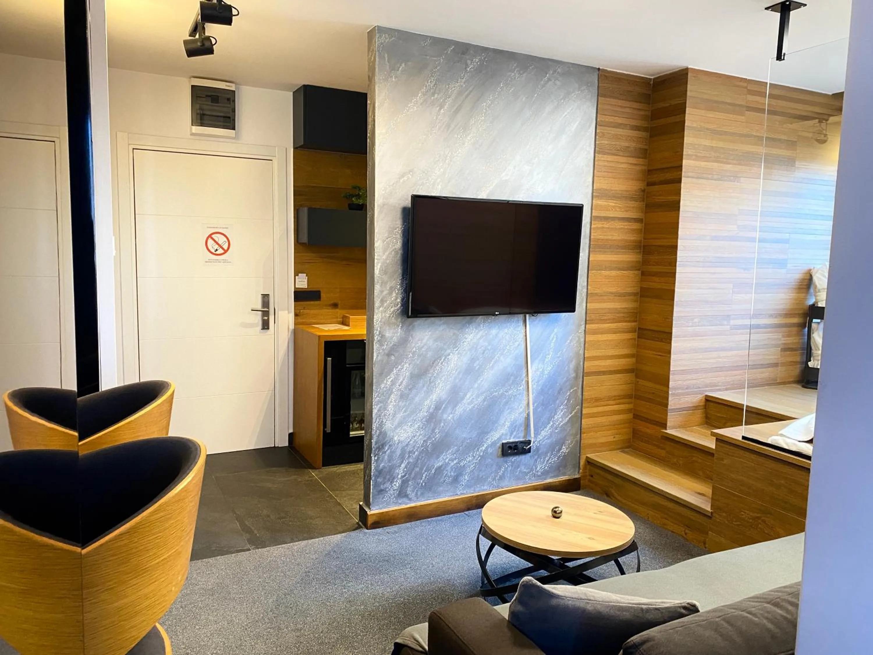 Communal lounge/ TV room in Black Pearl Luxury Suites