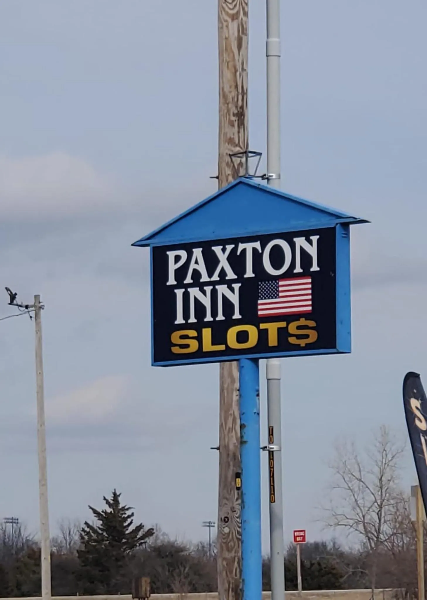 Property logo or sign in Paxton Inn Motel