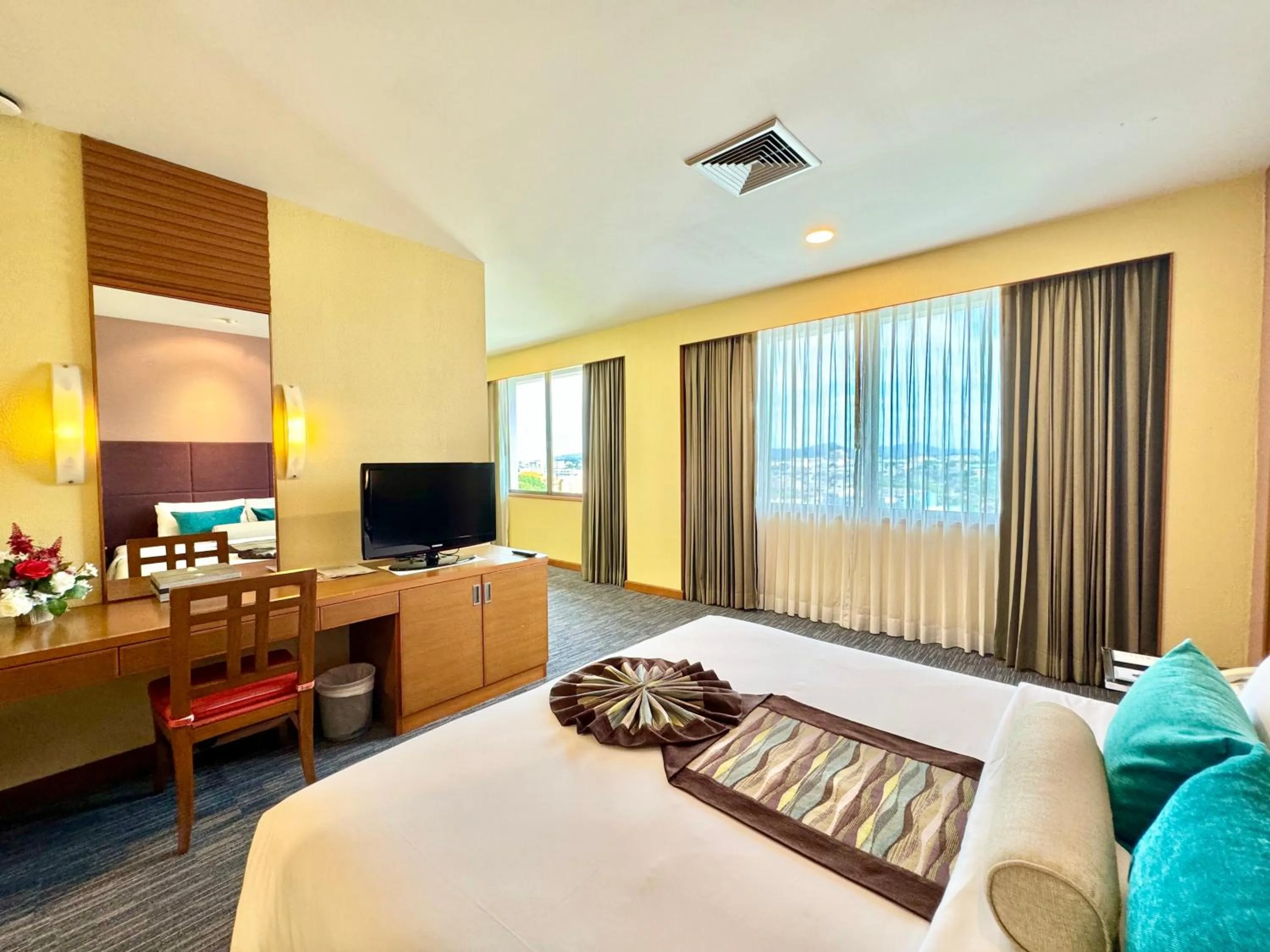 Bed in Phuket Merlin Hotel