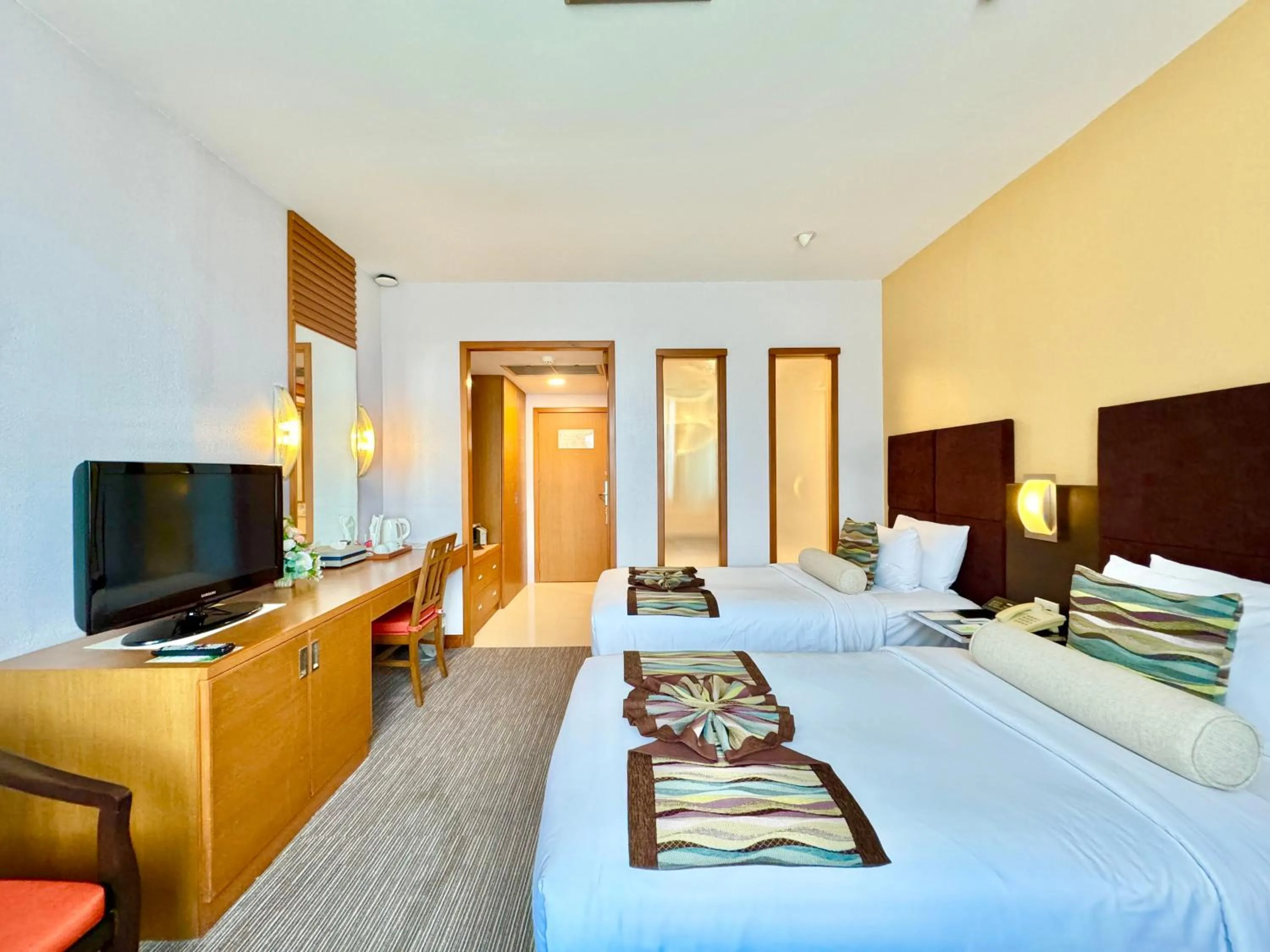 Bed in Phuket Merlin Hotel