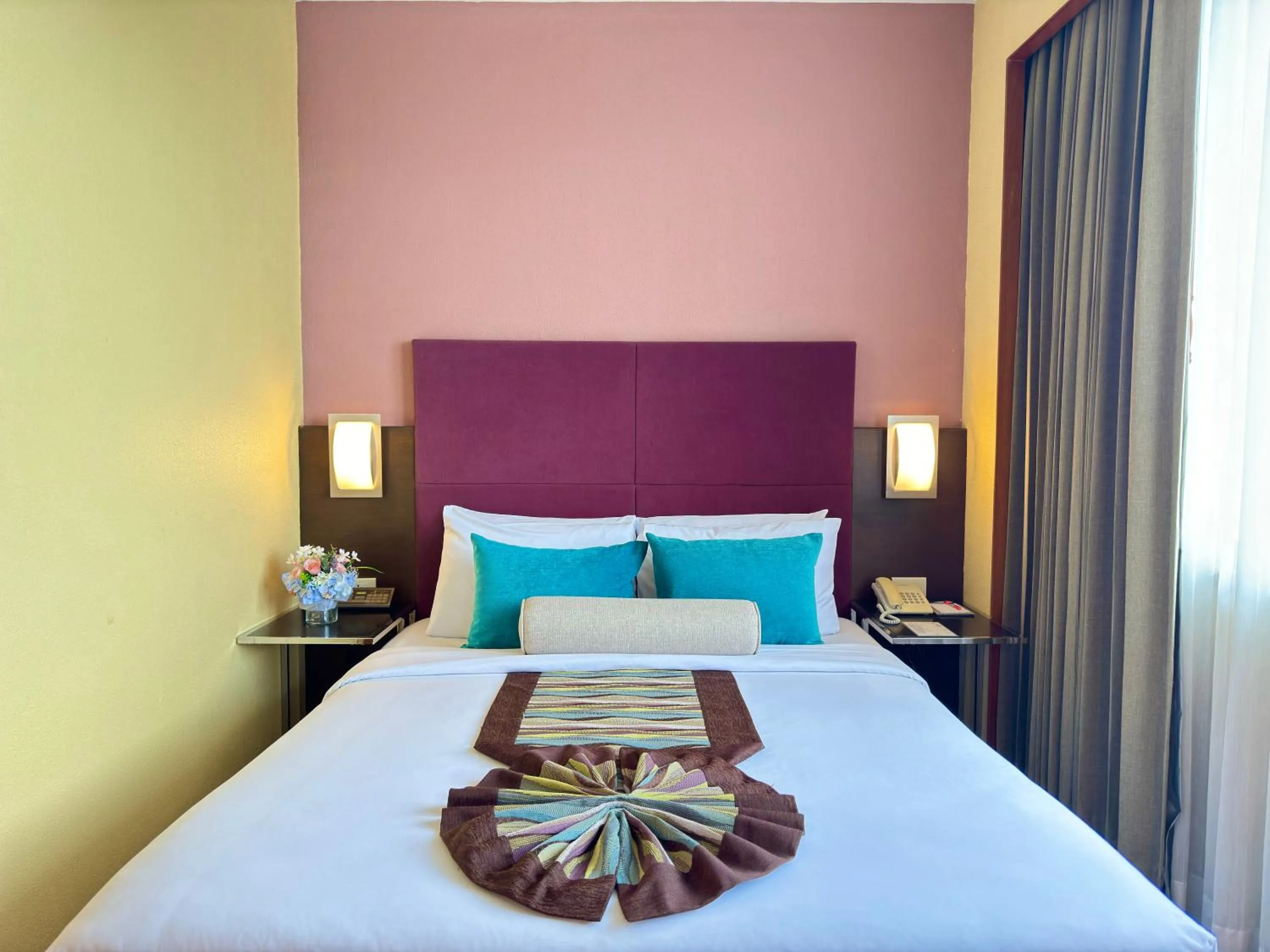 Bed in Phuket Merlin Hotel